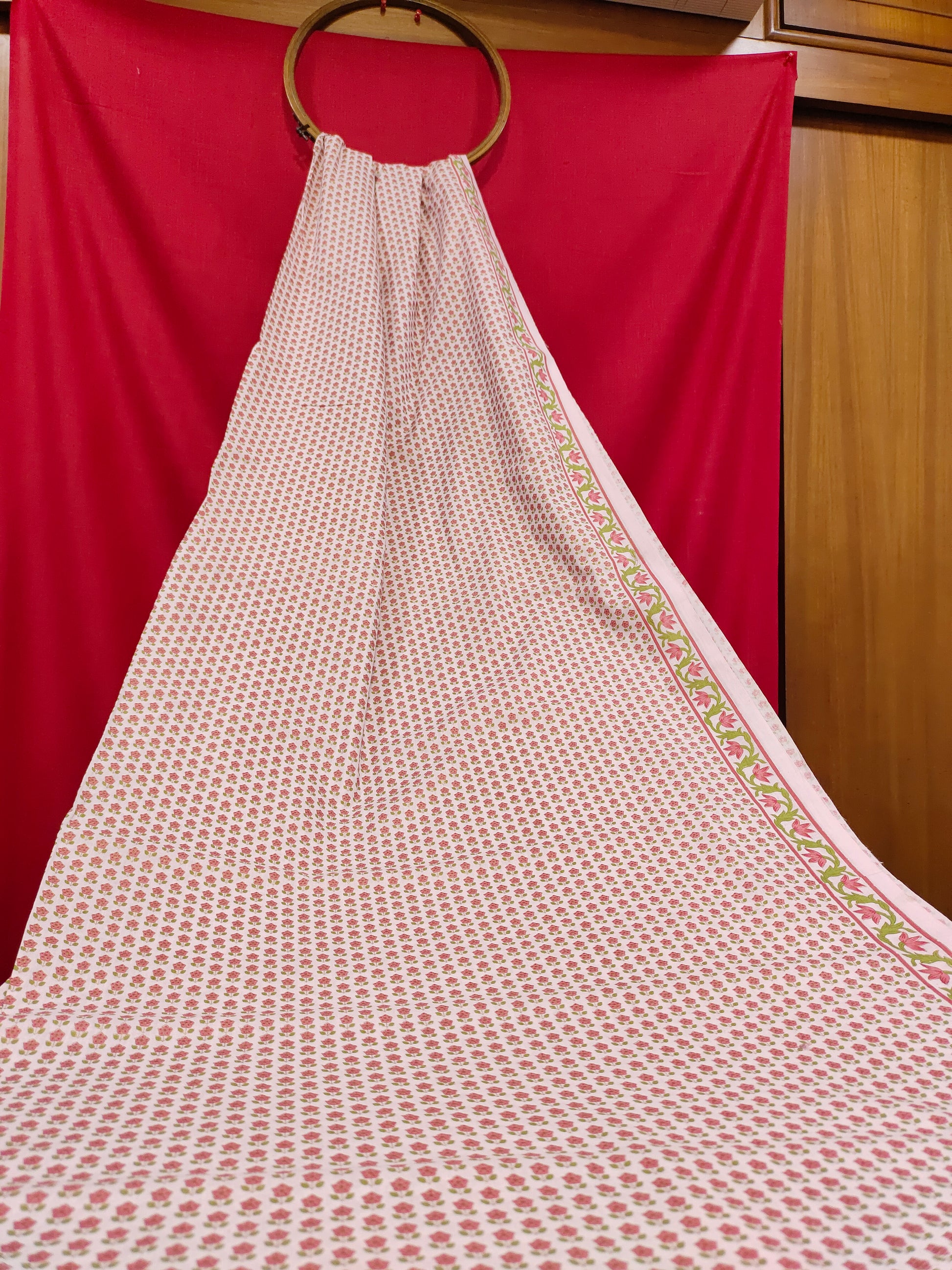 White base screen print of pink flowers