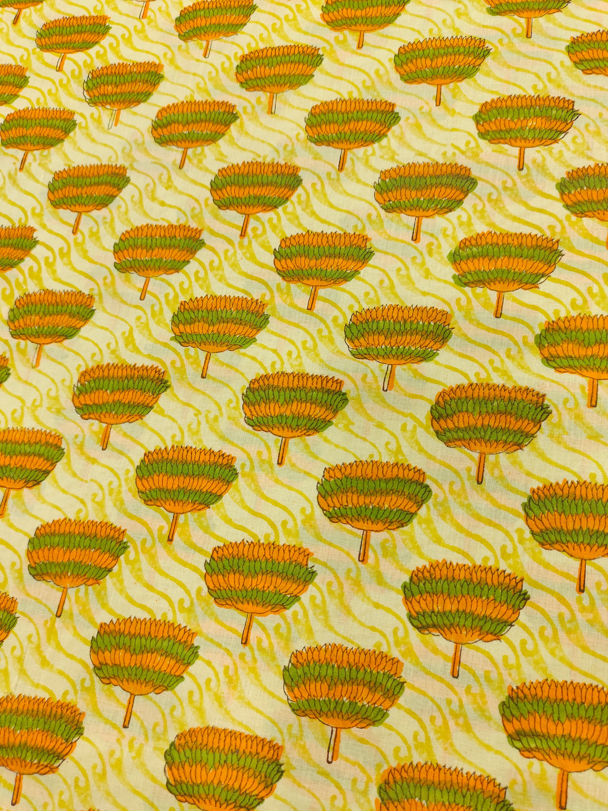 Yellow fabric with orange and green screen print