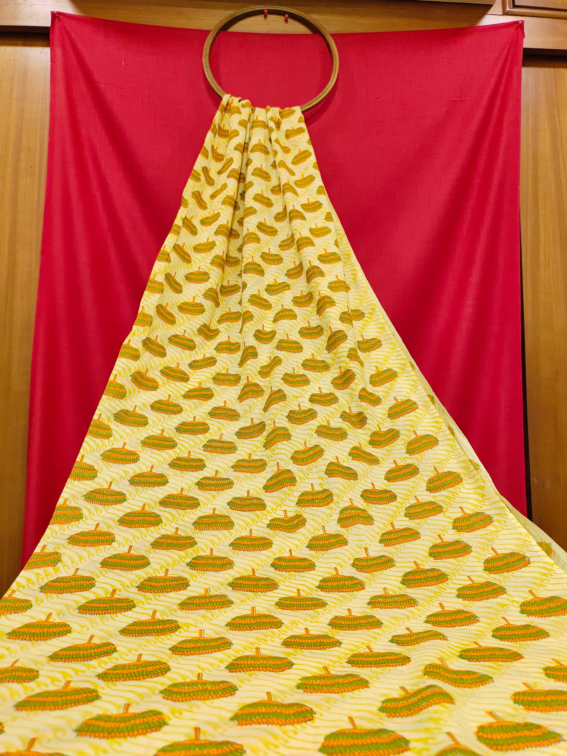 Yellow fabric with orange and green screen print