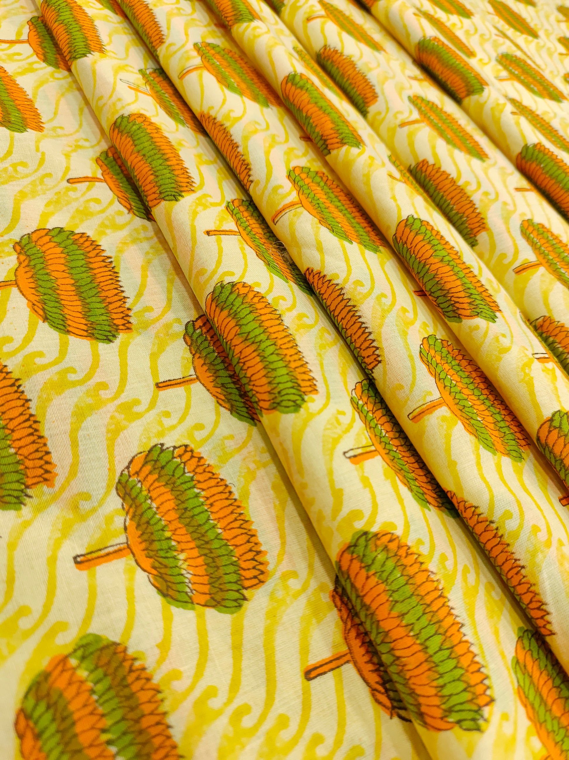 Yellow fabric with orange and green screen print