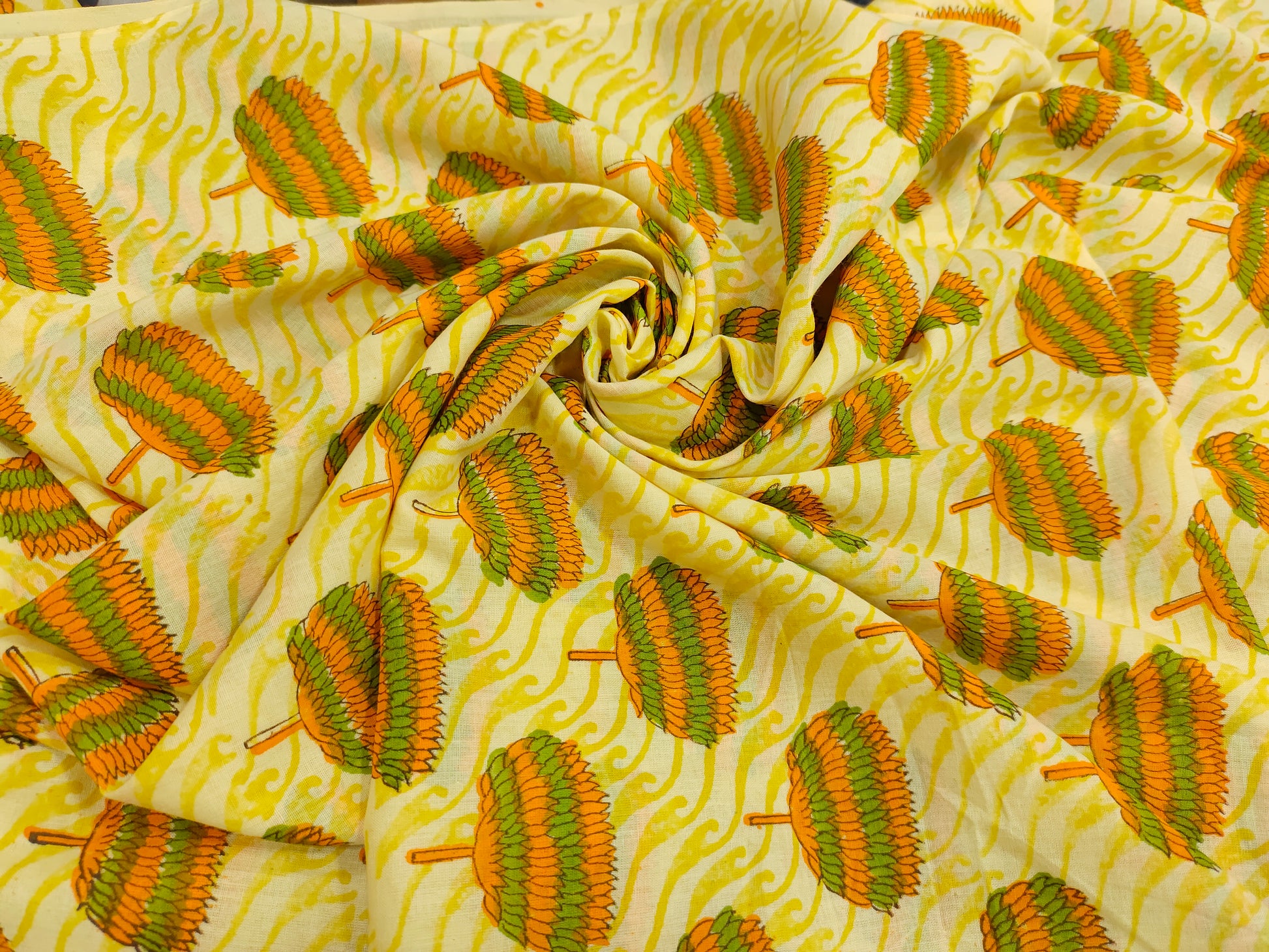Yellow fabric with orange and green screen print