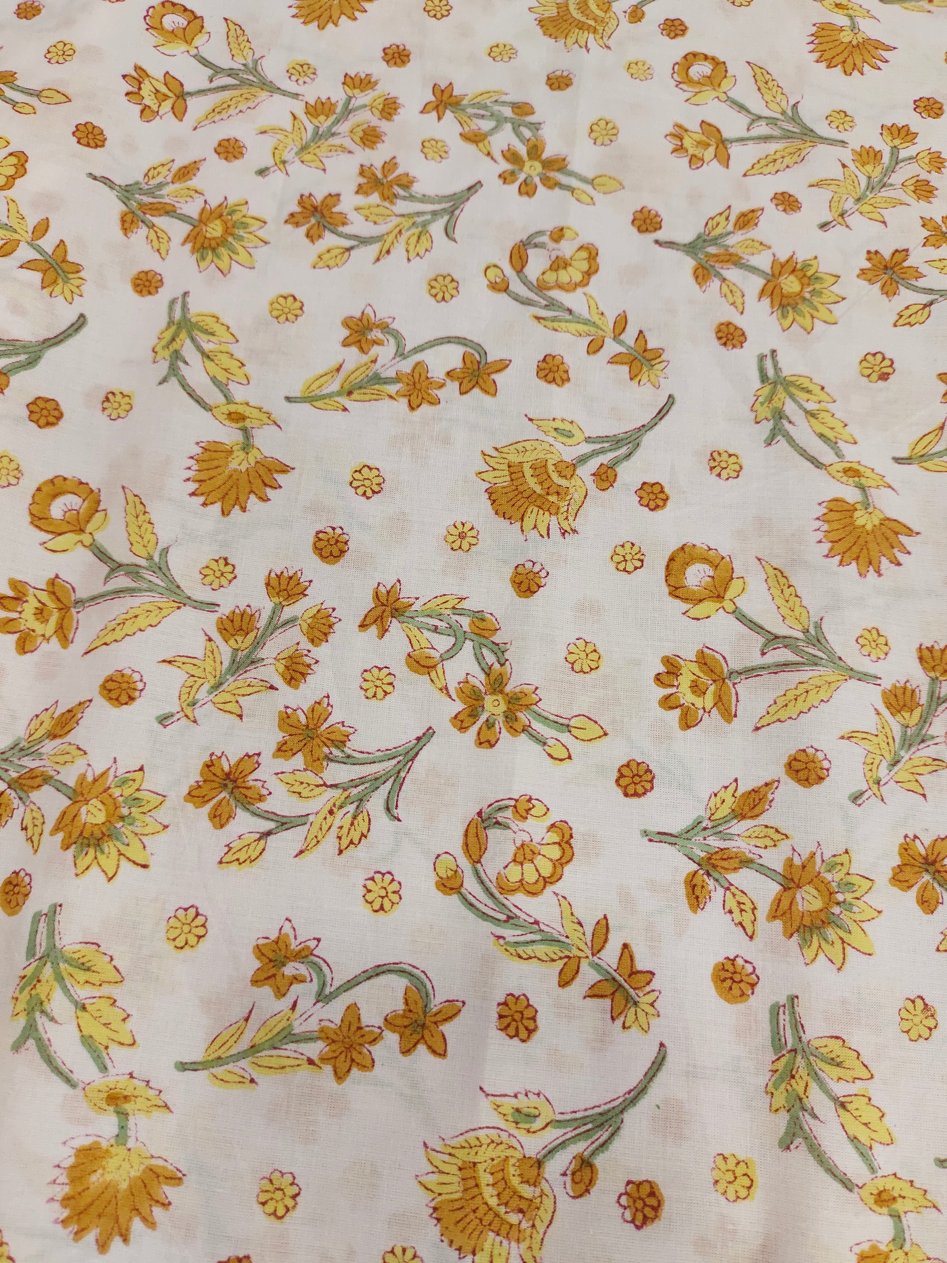 Yellow with mustard flowers on a white base cotton handblock print