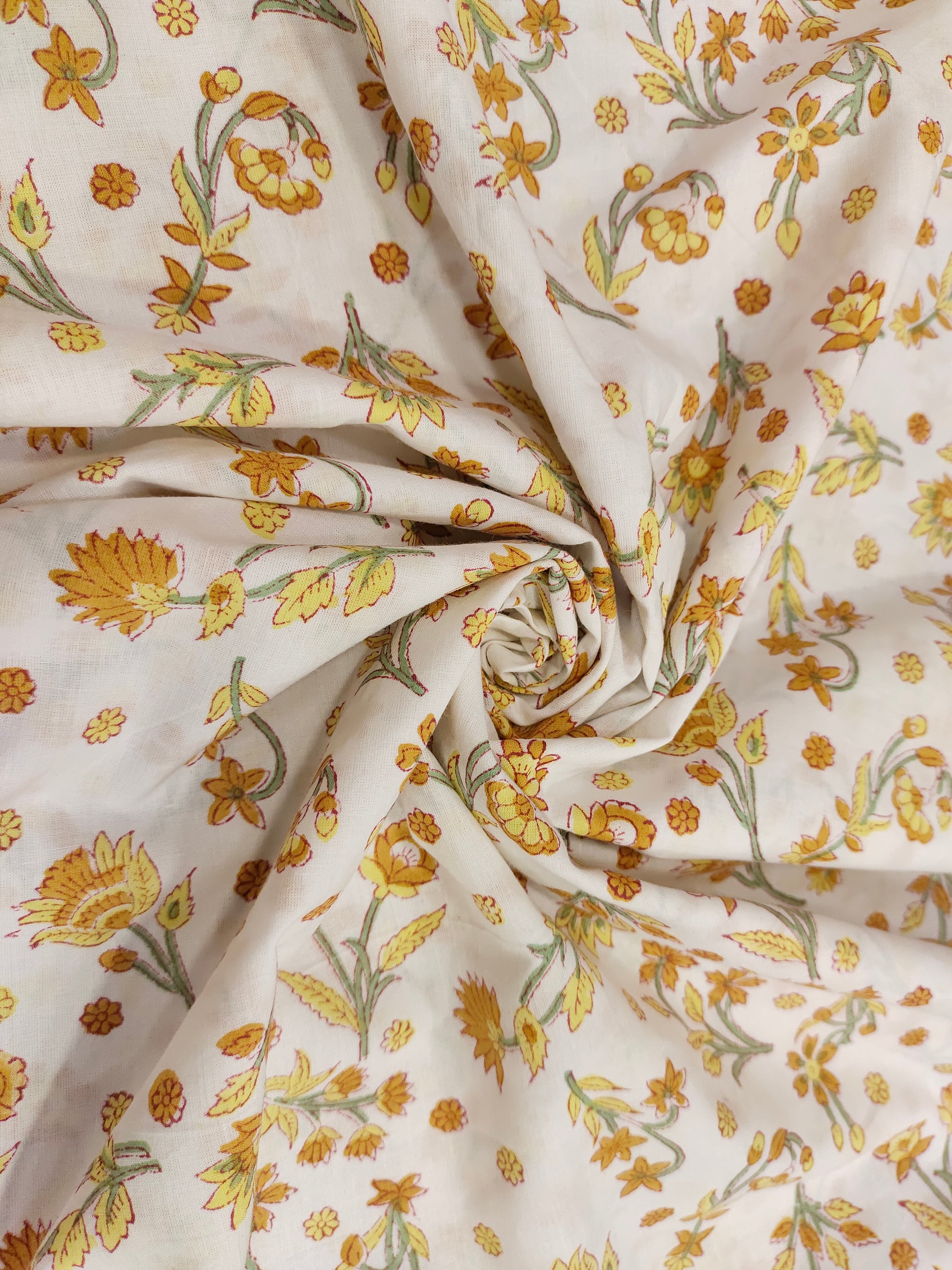 Yellow with mustard flowers on a white base cotton handblock print