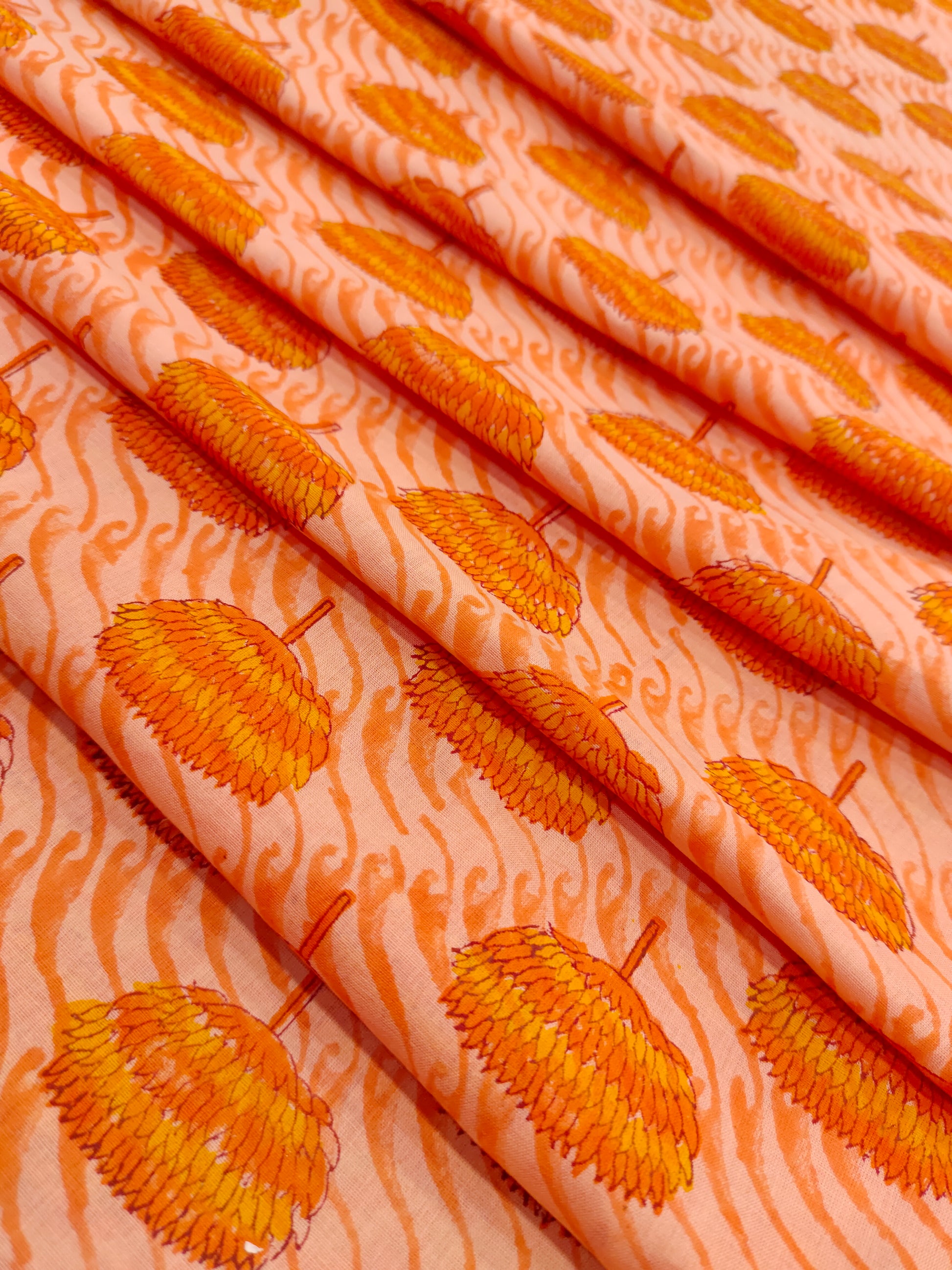 orange handblock print with orange flowers