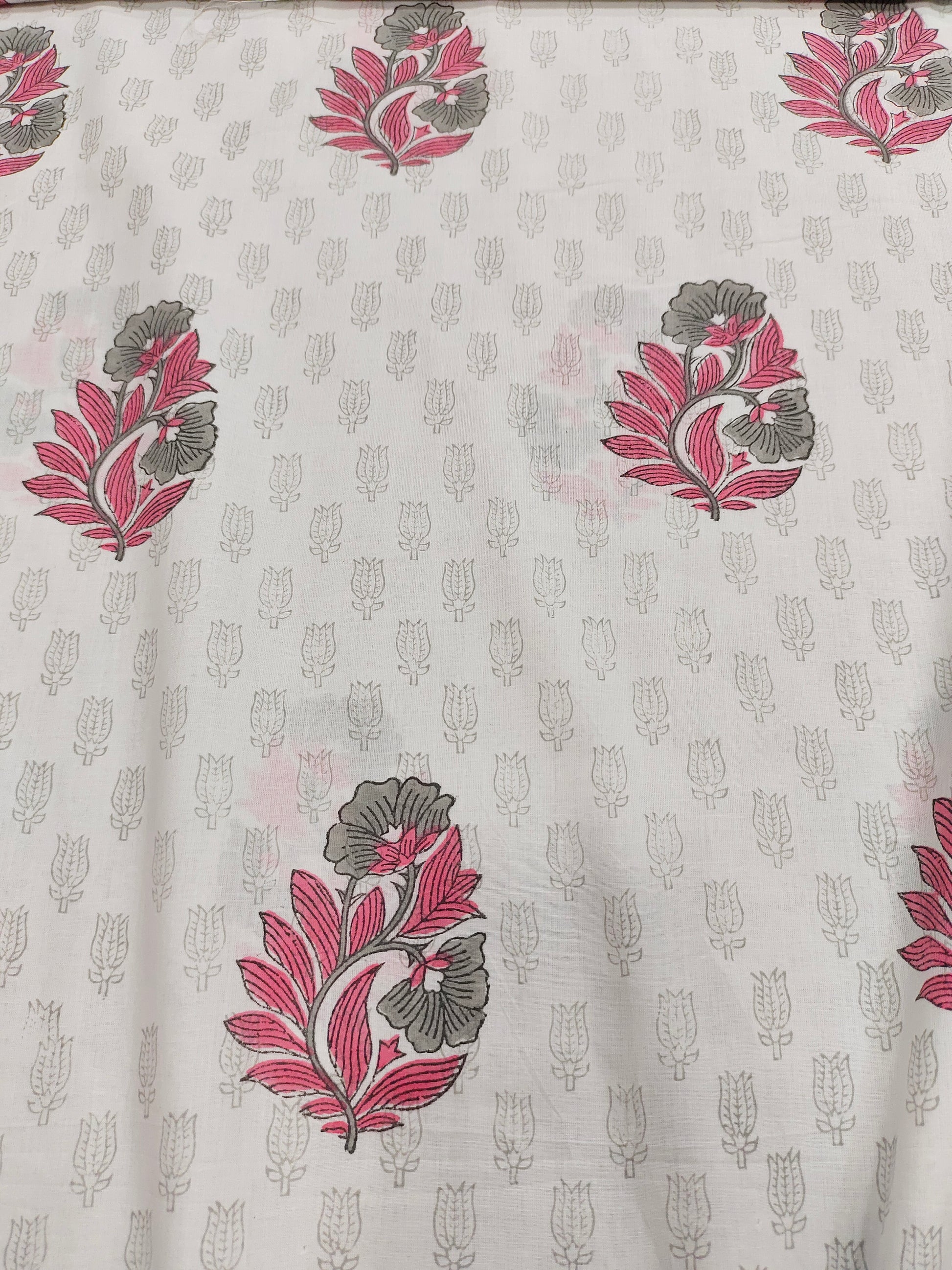 Pink and grey handblock print on white fabric