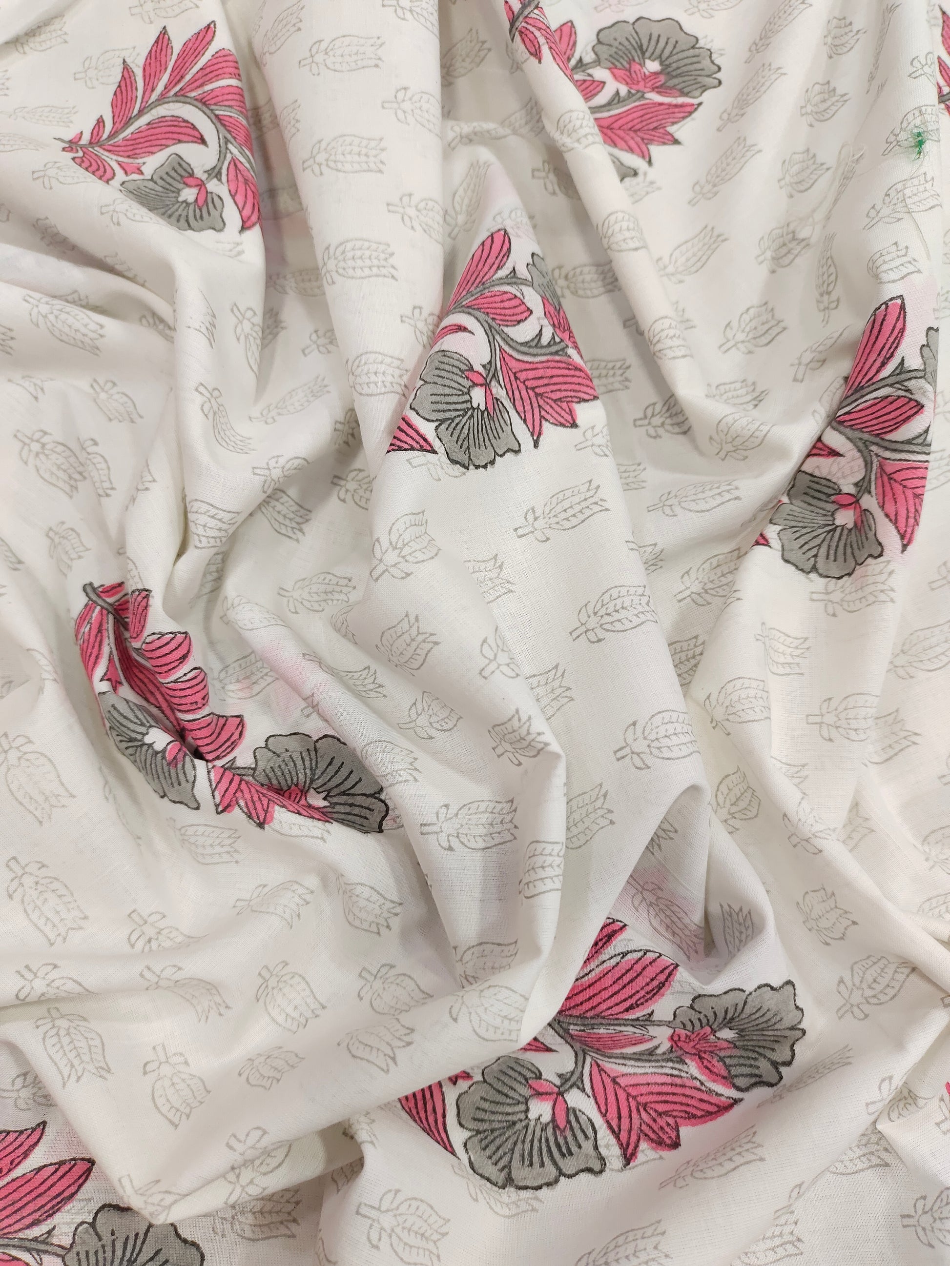 Pink and grey handblock print on white fabric