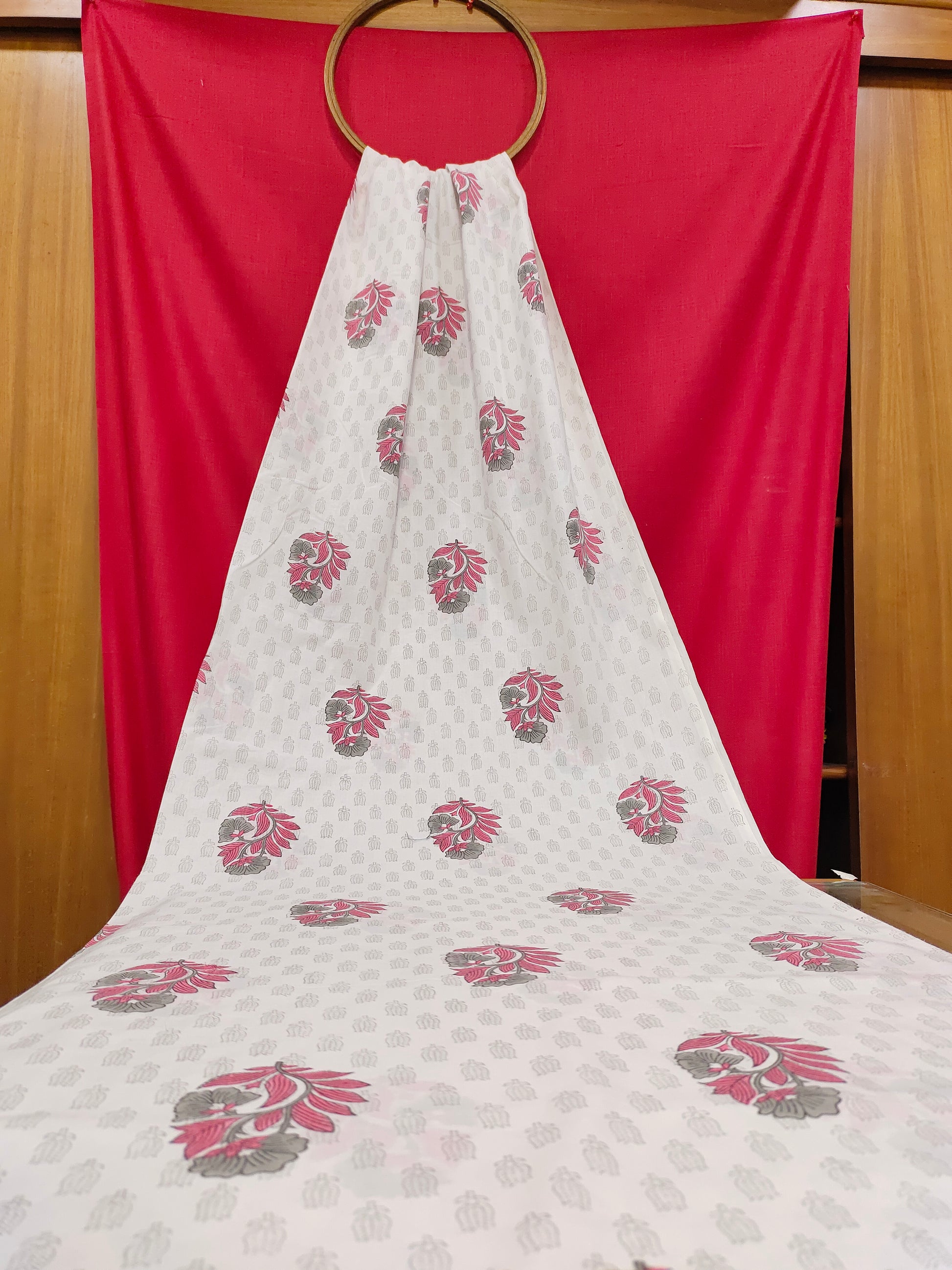 Pink and grey handblock print on white fabric