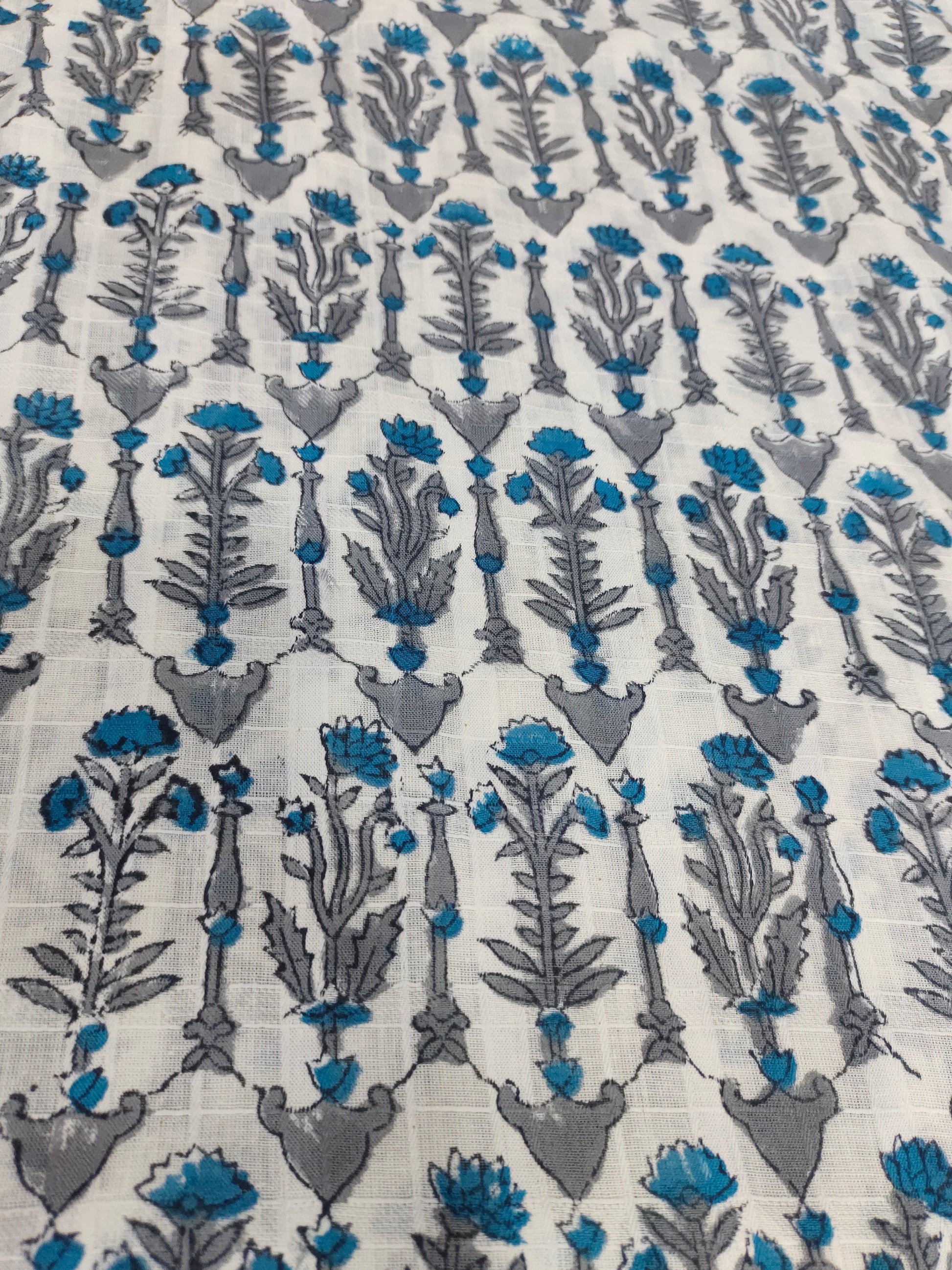 Handblock print with blue and grey on white soft cotton fabric
