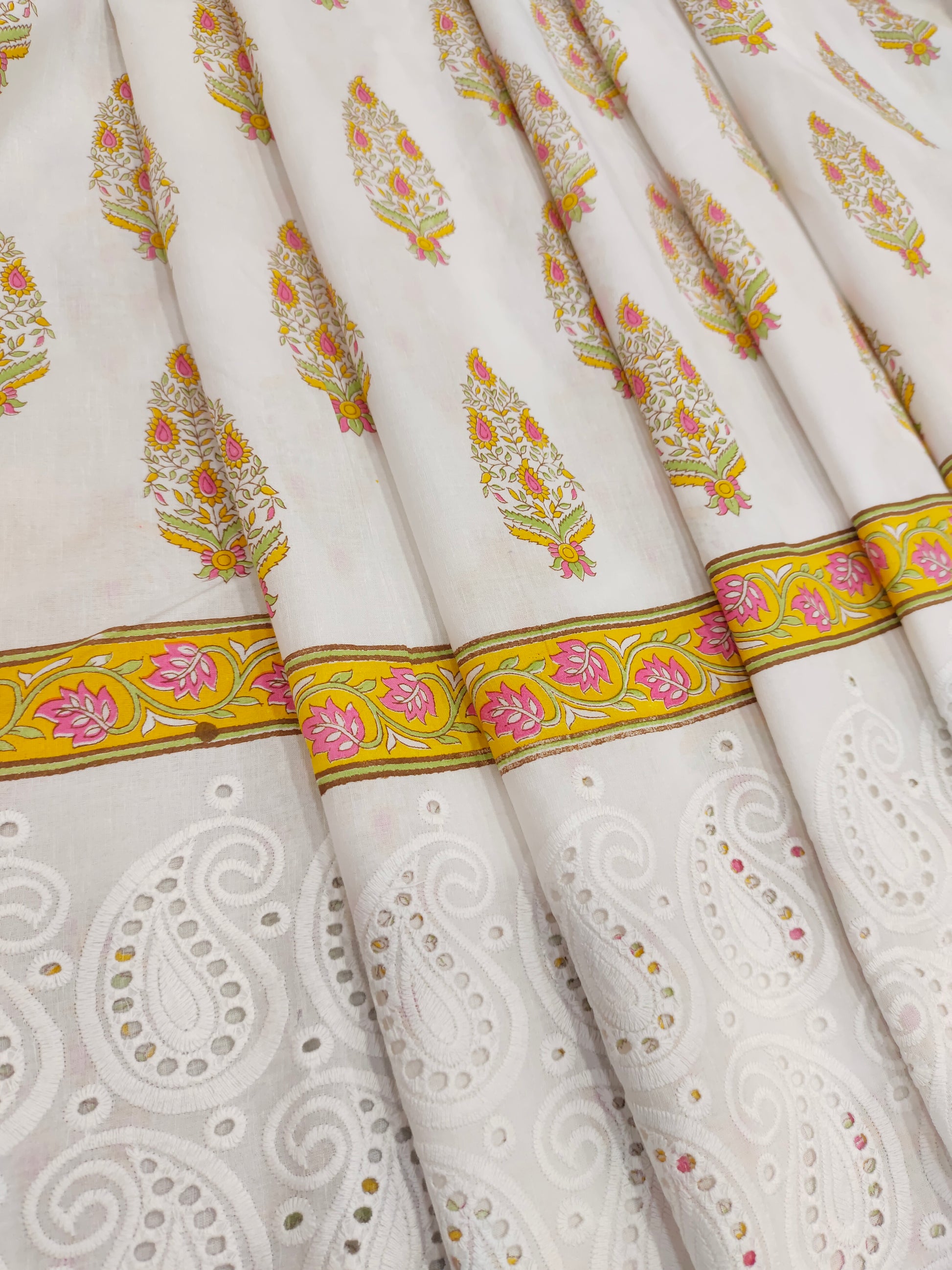 White daman cutwork border with yellow print