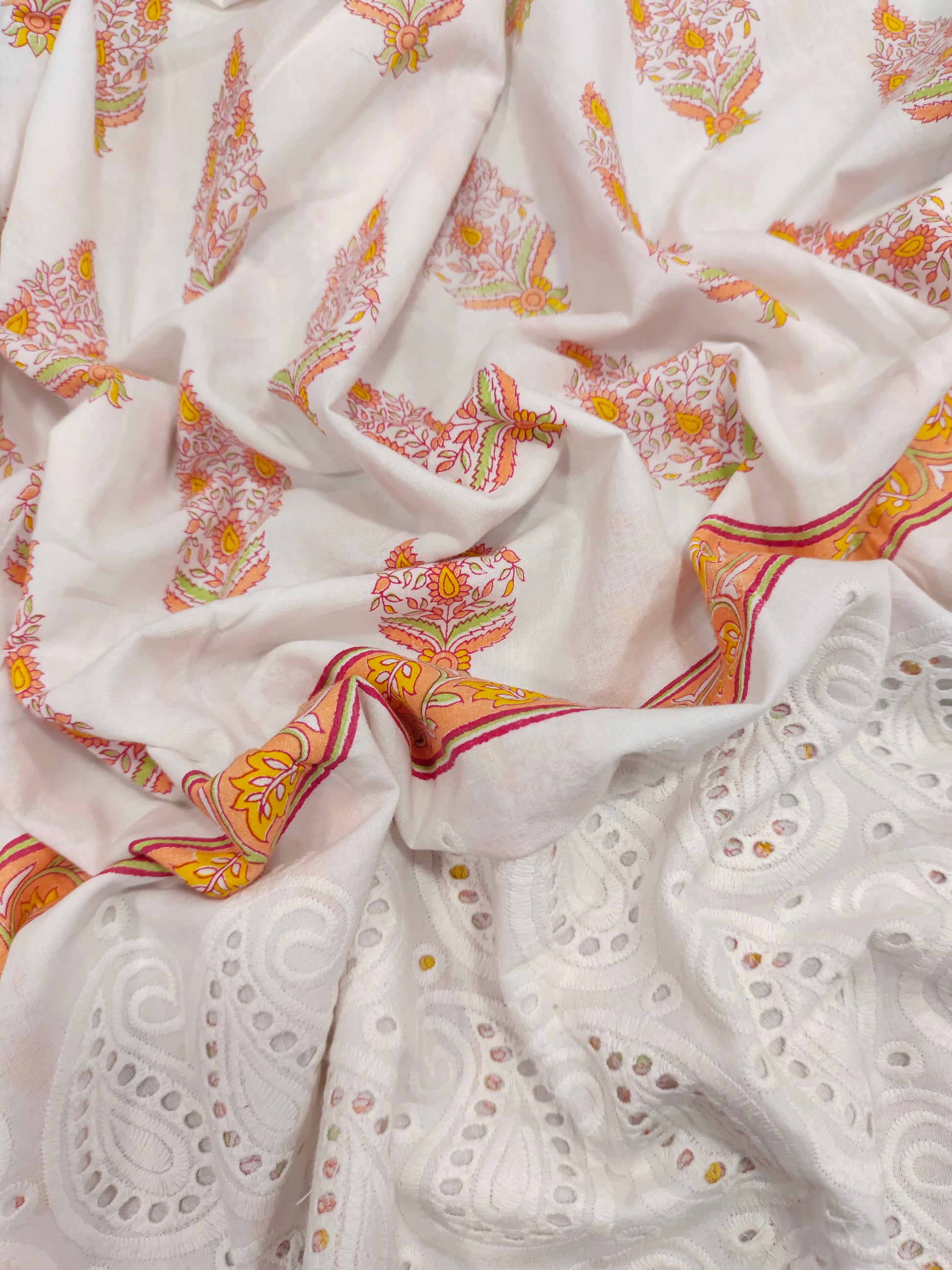 White cutwork daman fabric with orange print