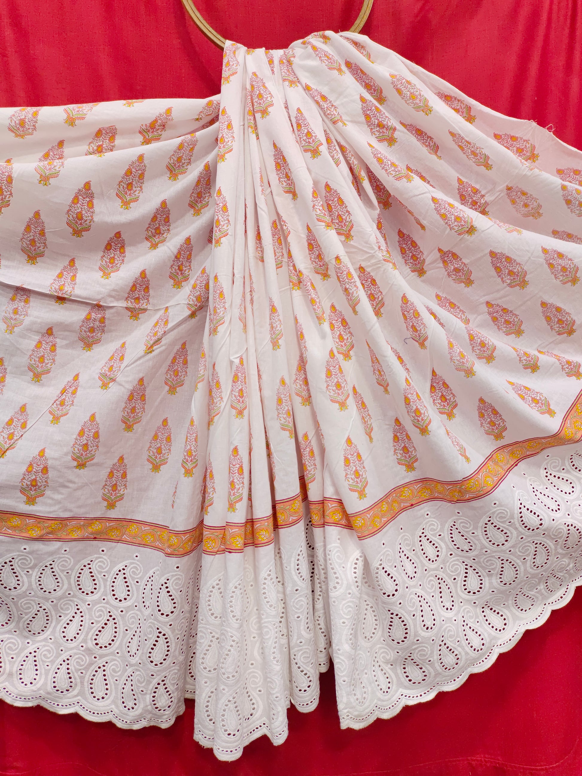 White cutwork daman fabric with orange print