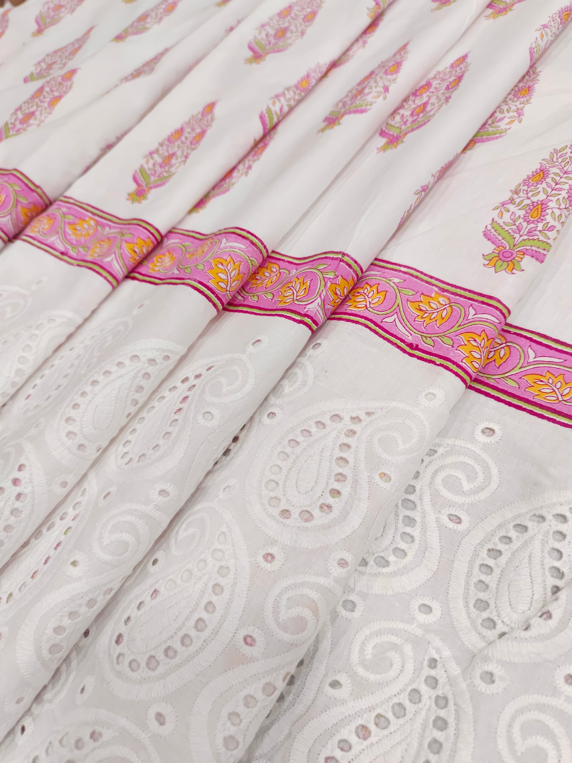 White daman cutwork embroidered fabric with pink print