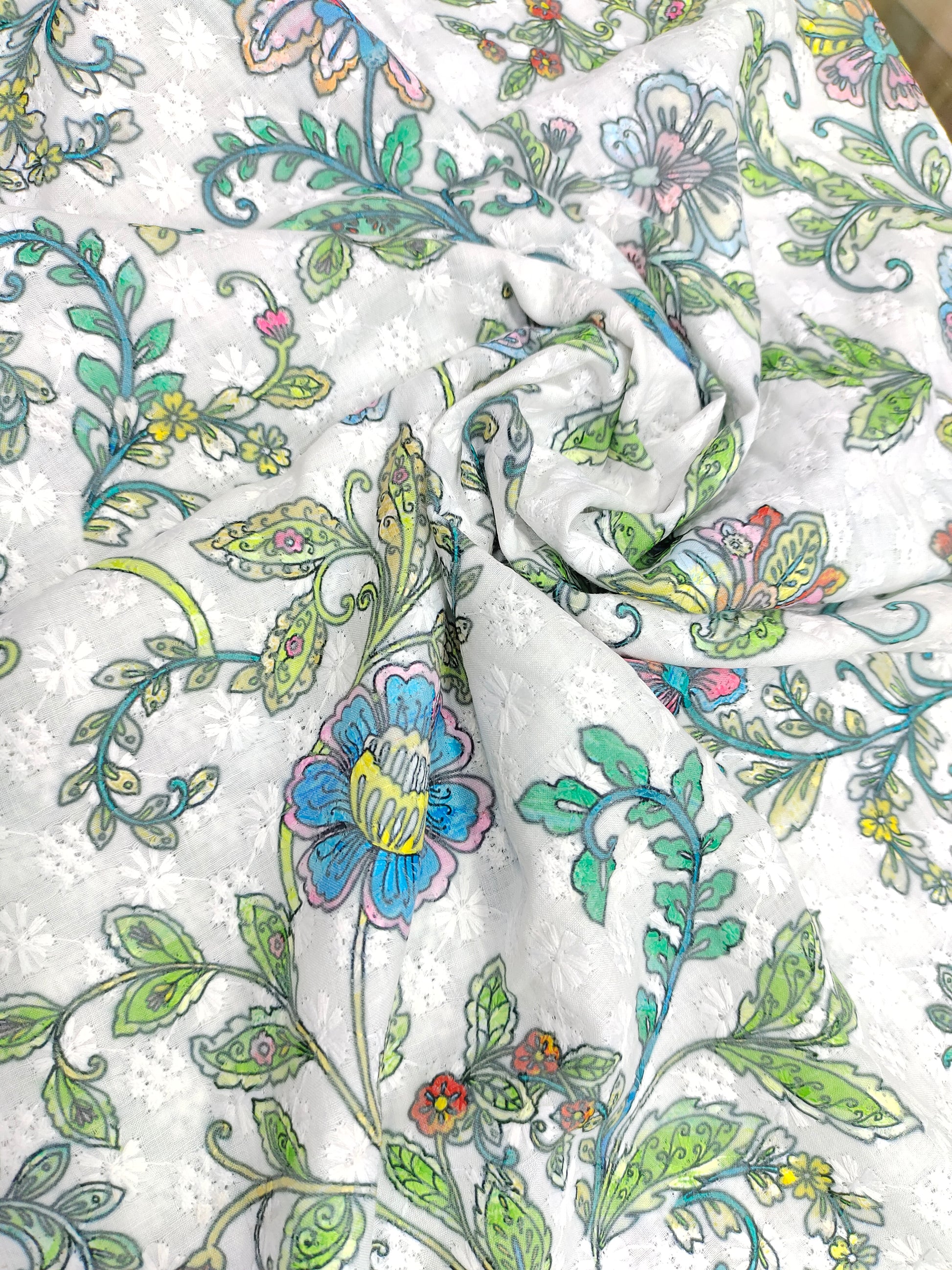 White embroidered fabric digital print with blue pink and green