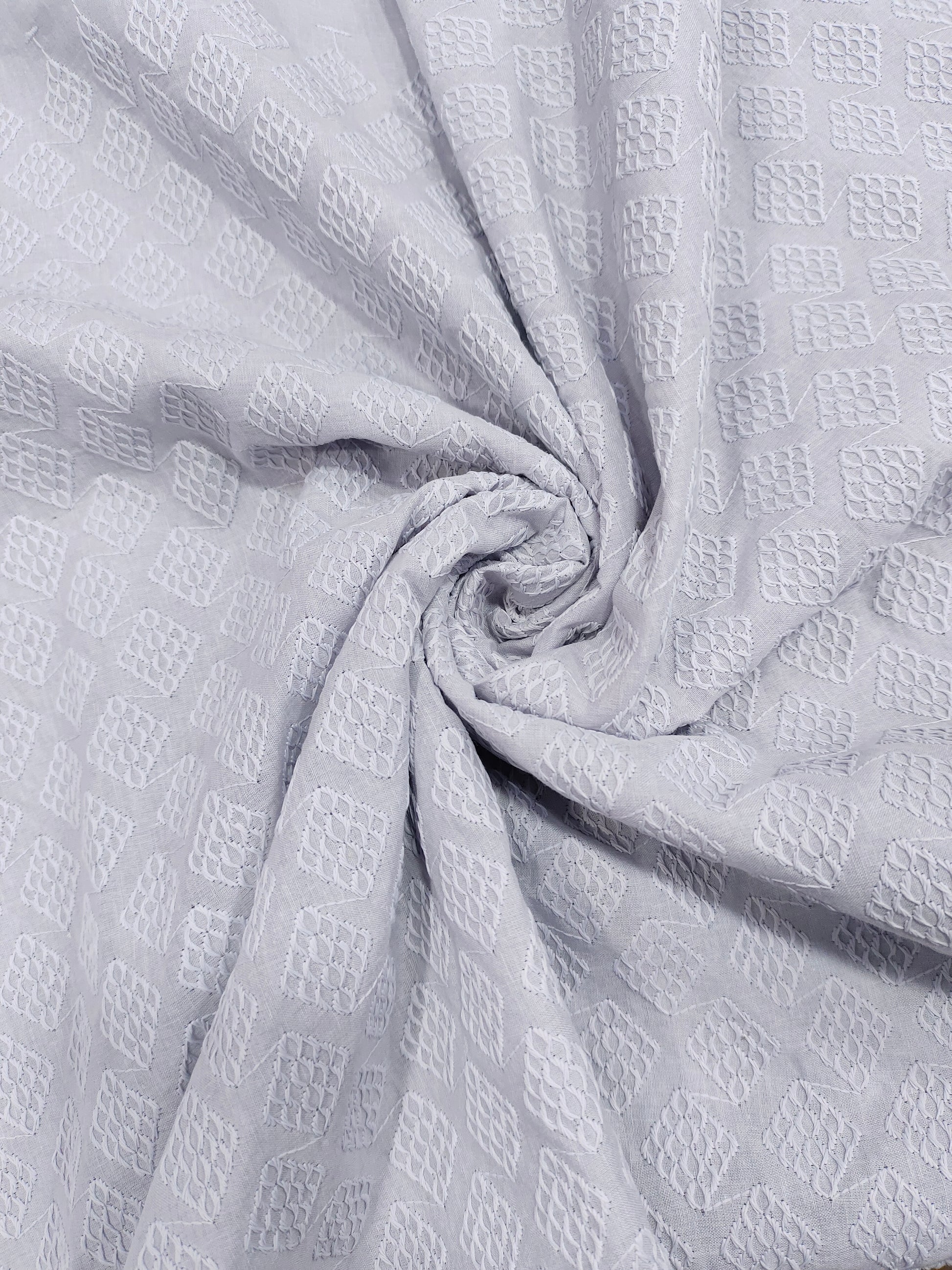Grey embroidered fabric