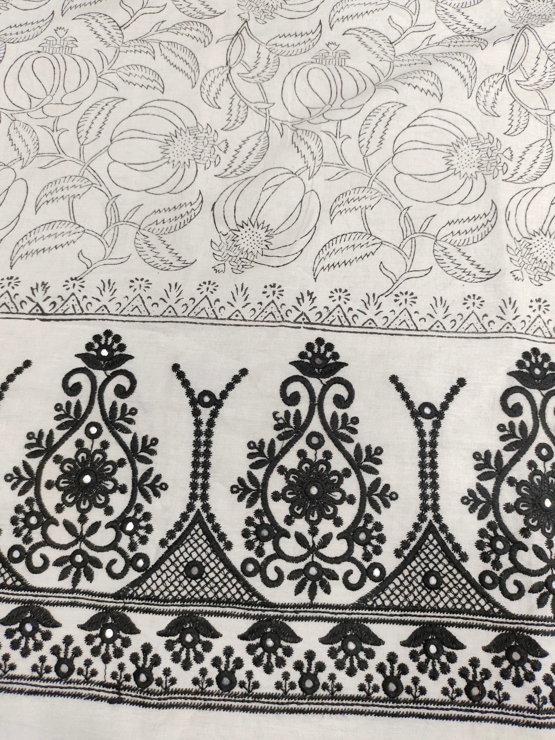 White fabric with black  handblock print and added with schiffli daman