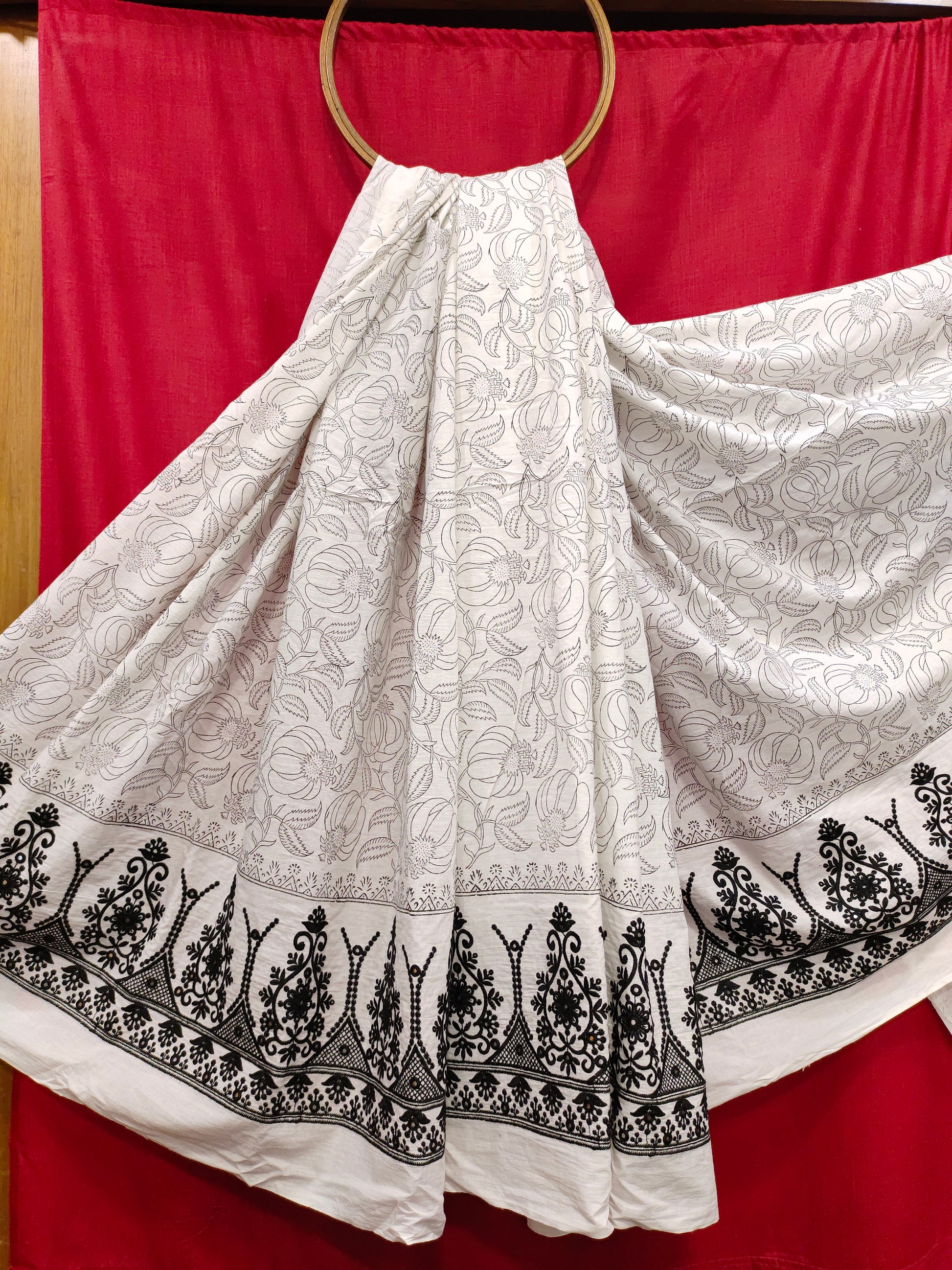 White fabric with black  handblock print and added with schiffli daman