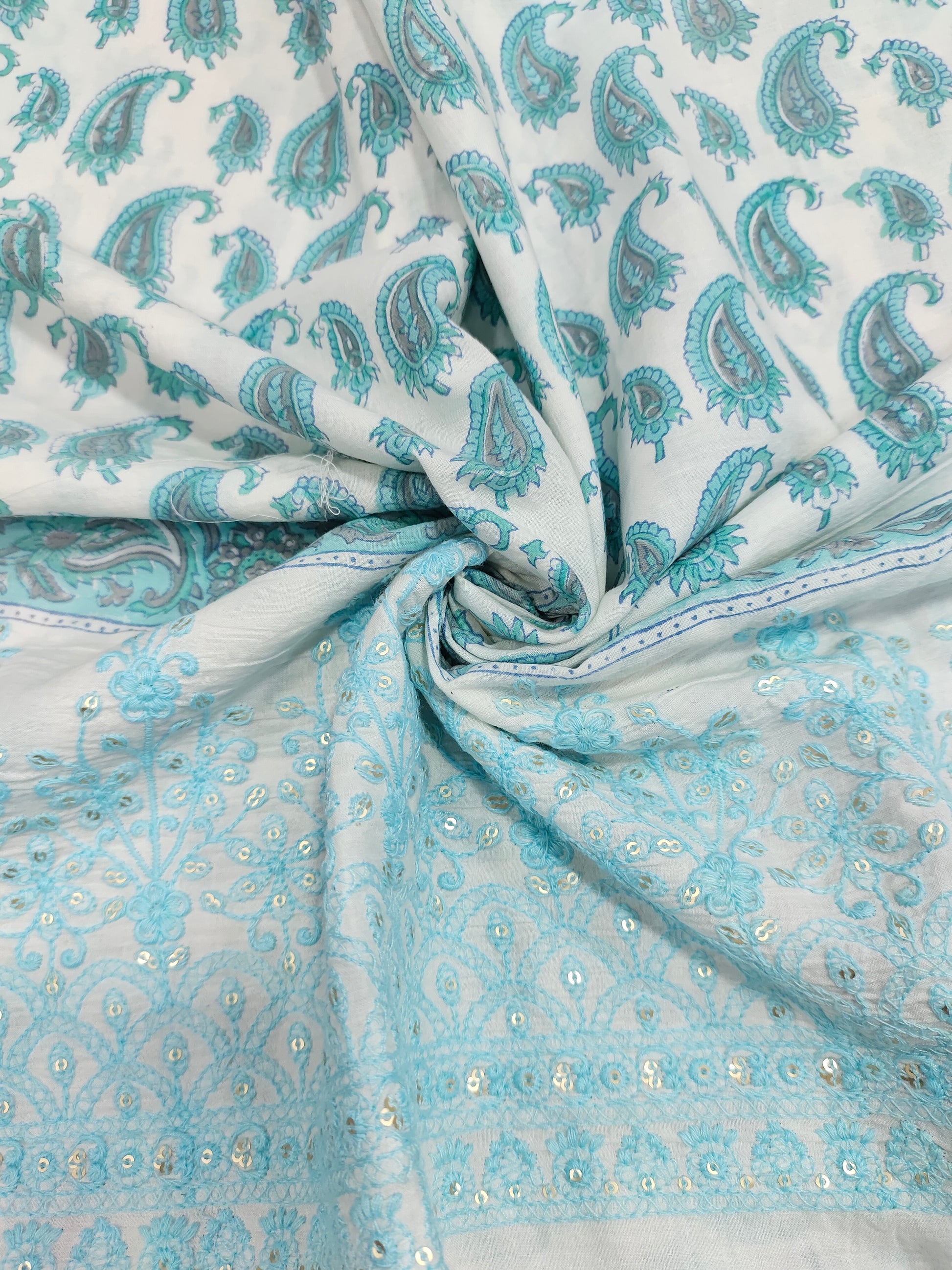 White fabric with blue handblock print and added with schiffli daman
