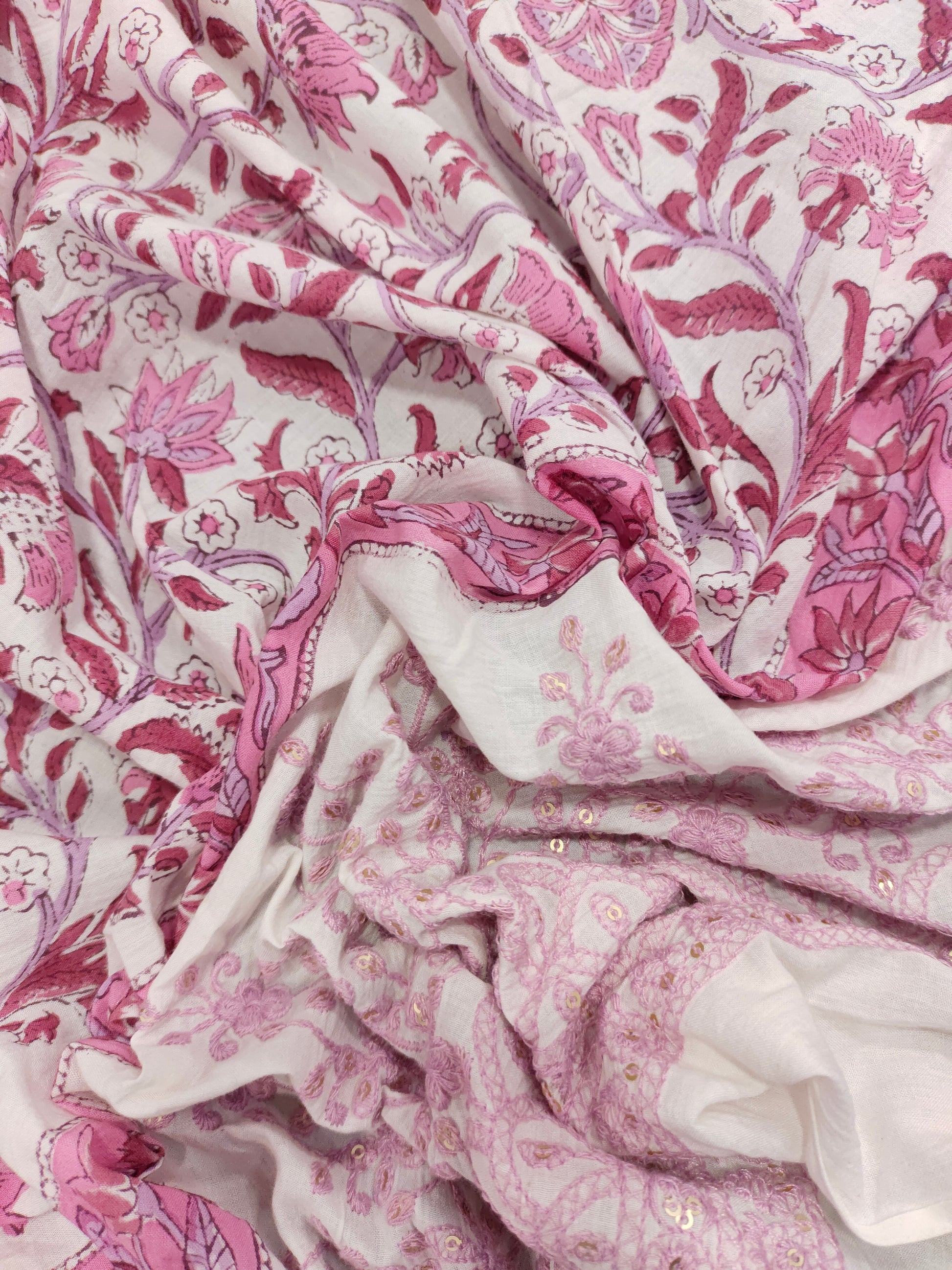 White fabric with pink handblock print and added with schiffli daman