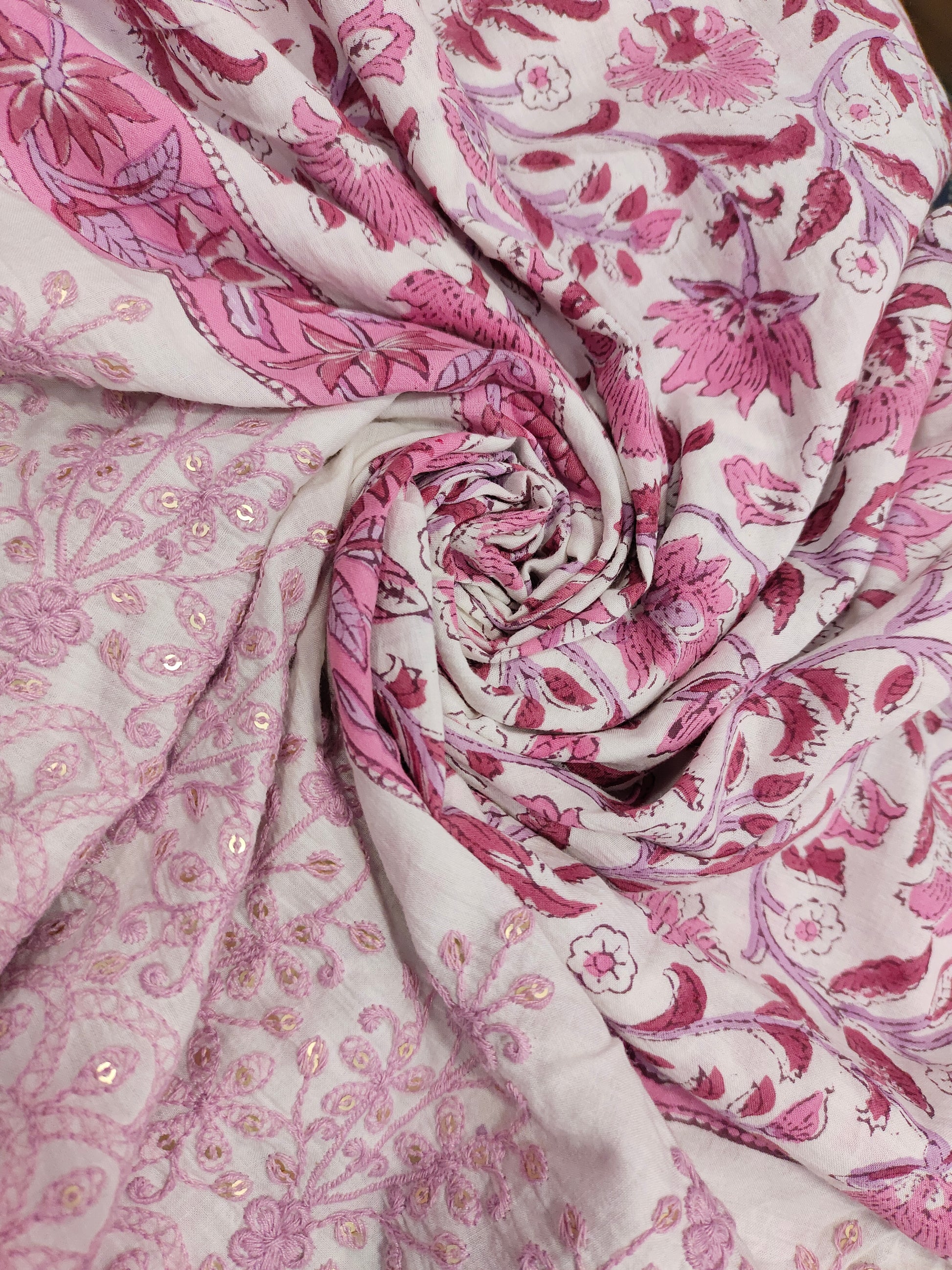 White fabric with pink handblock print and added with schiffli daman