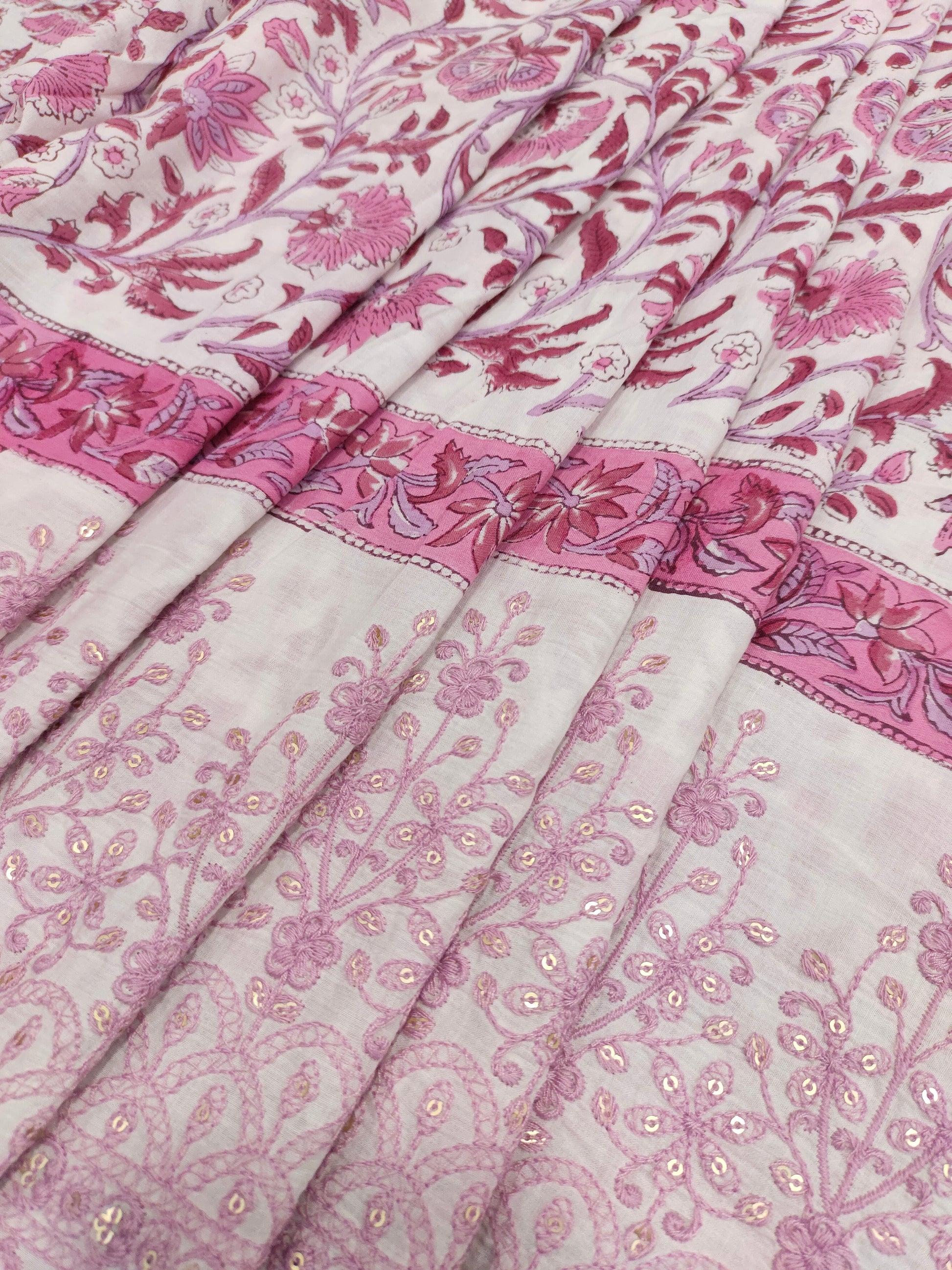 White fabric with pink handblock print and added with schiffli daman