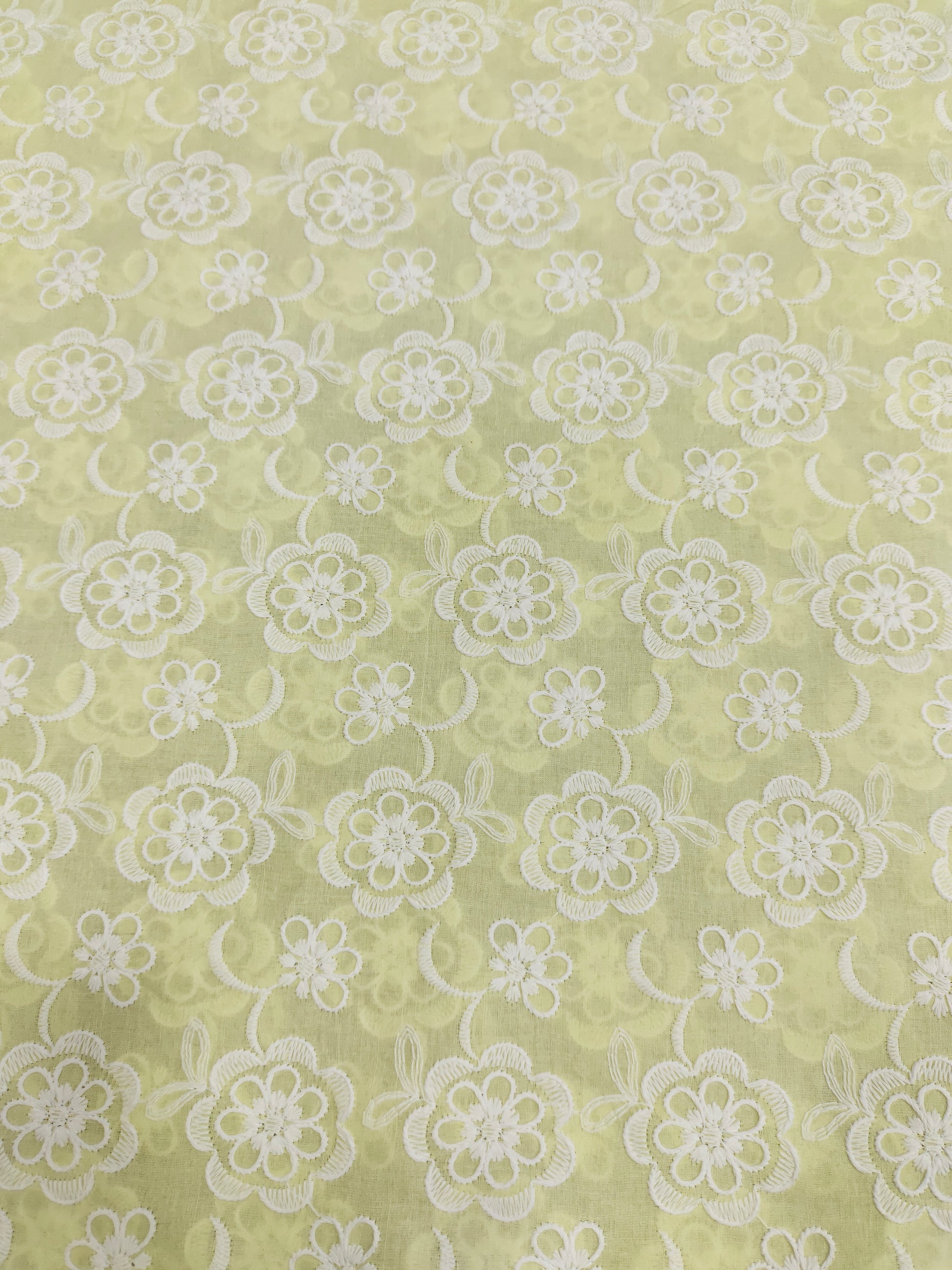 Light lemon embroidered fabric