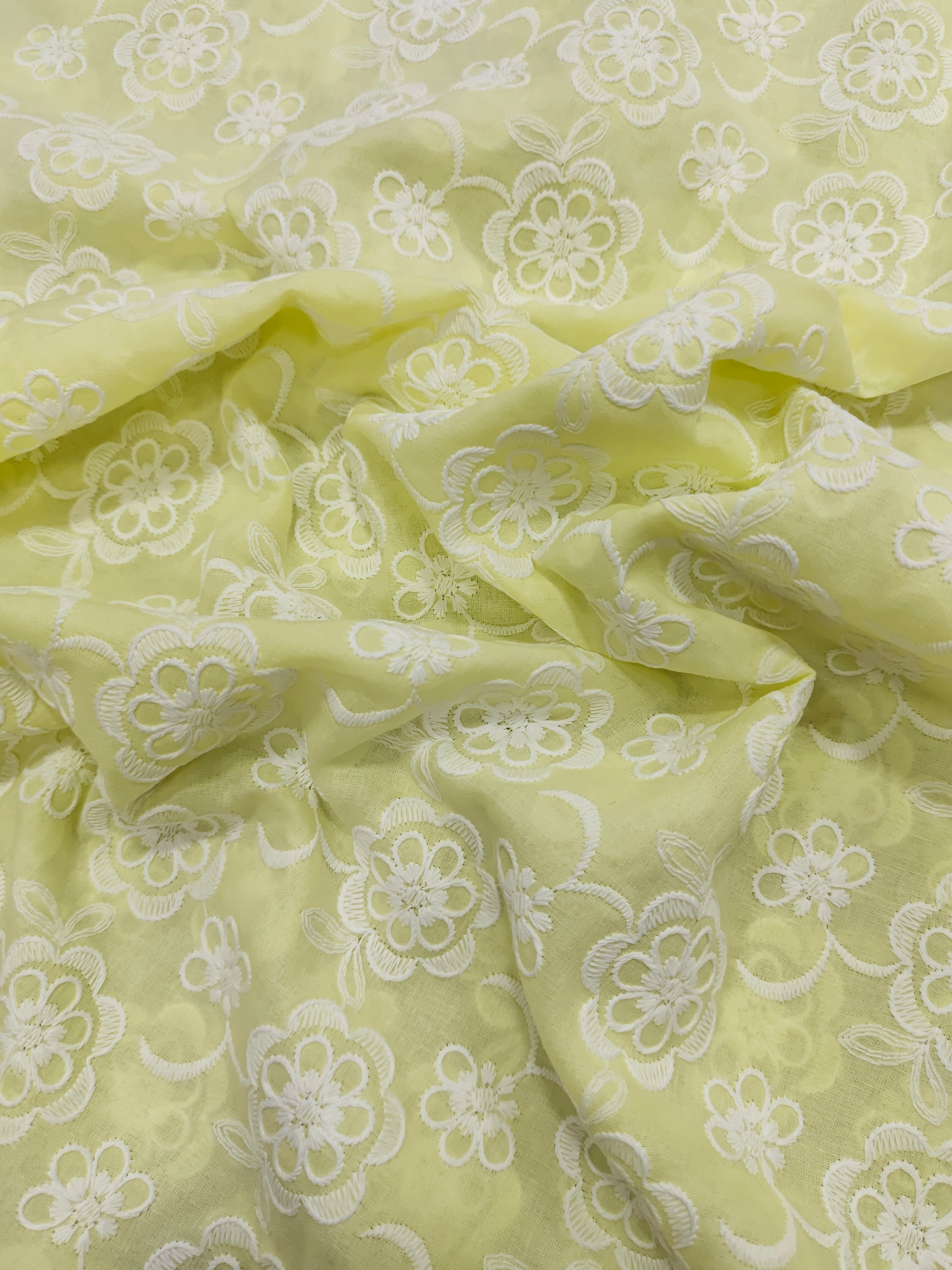 Light lemon embroidered fabric