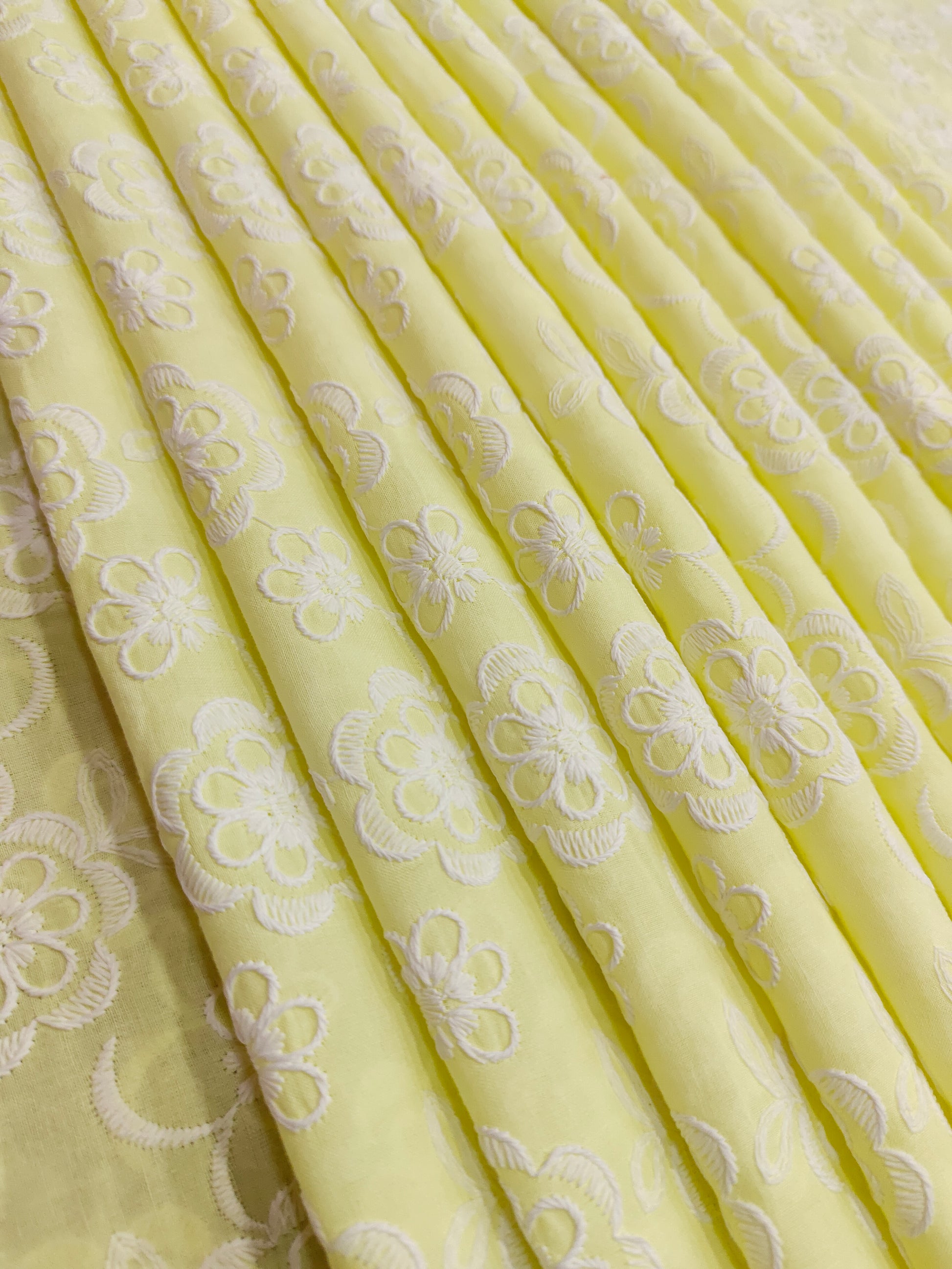 Light lemon embroidered fabric