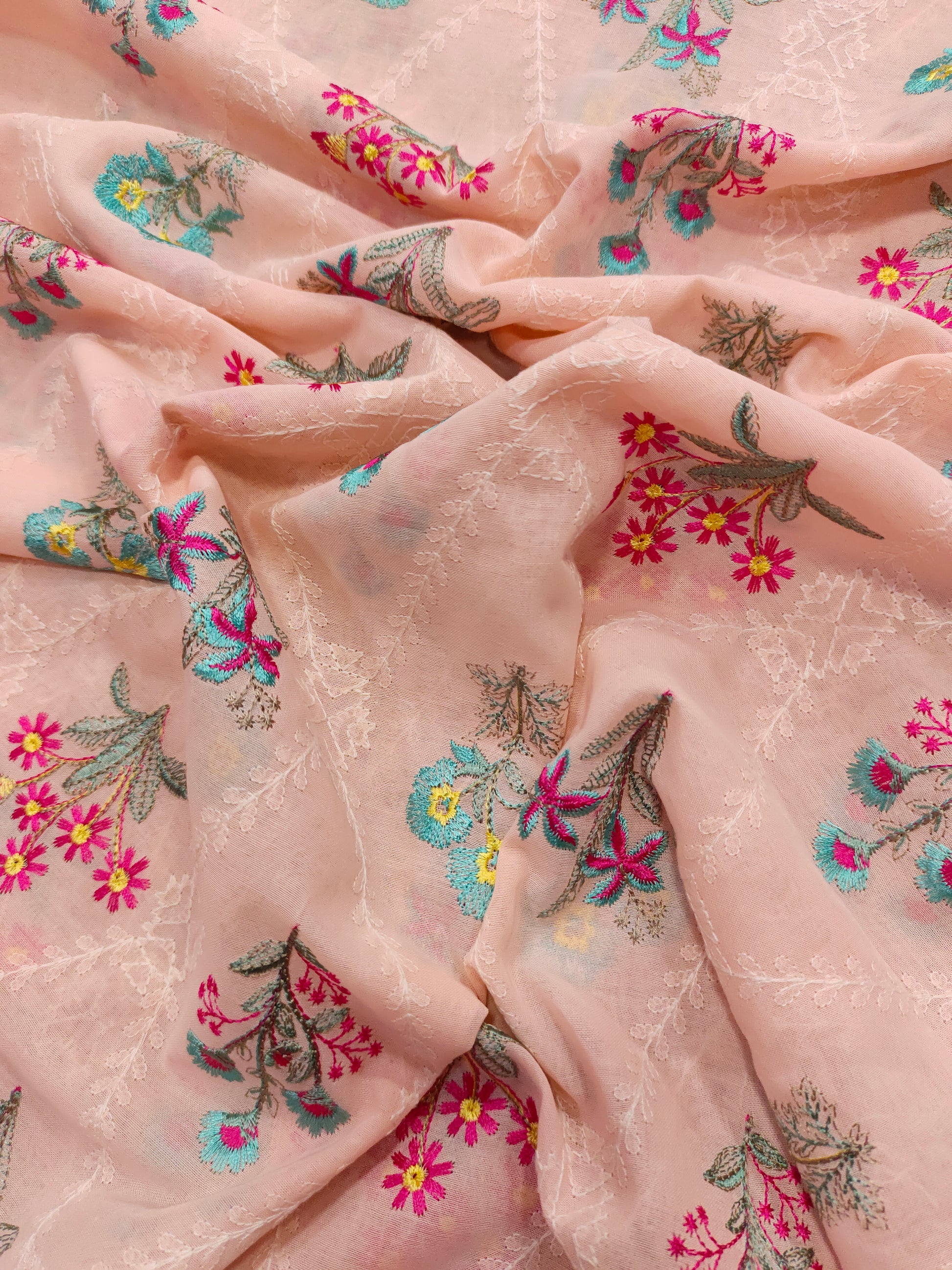 light peach floral embroidery  with blue and pink on voile fabric