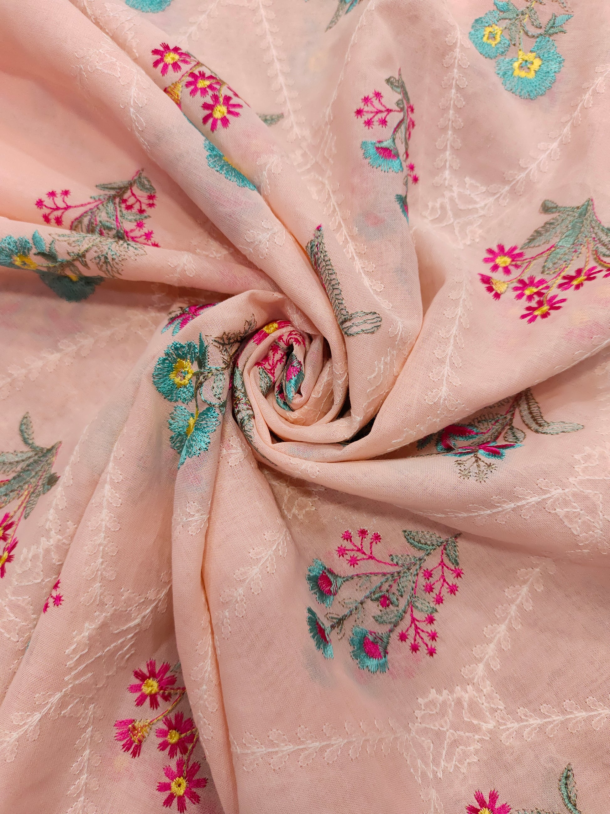 light peach floral embroidery  with blue and pink on voile fabric