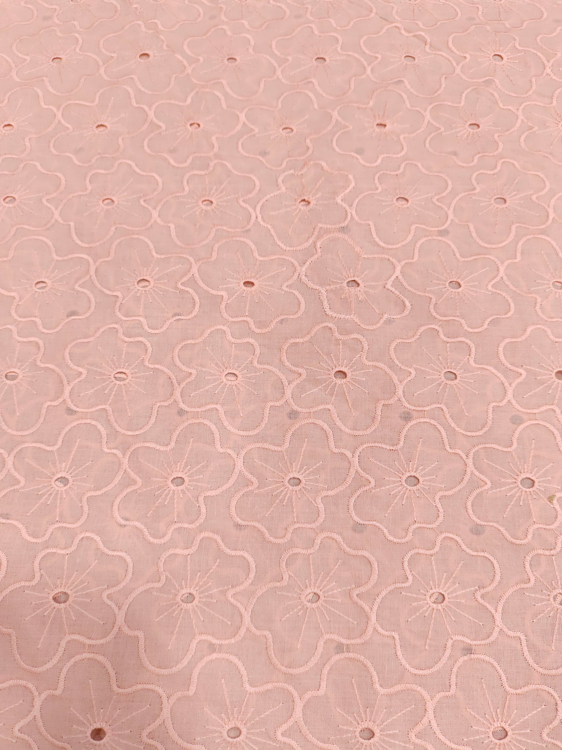 Peach cotton embroidery with small holes cut work