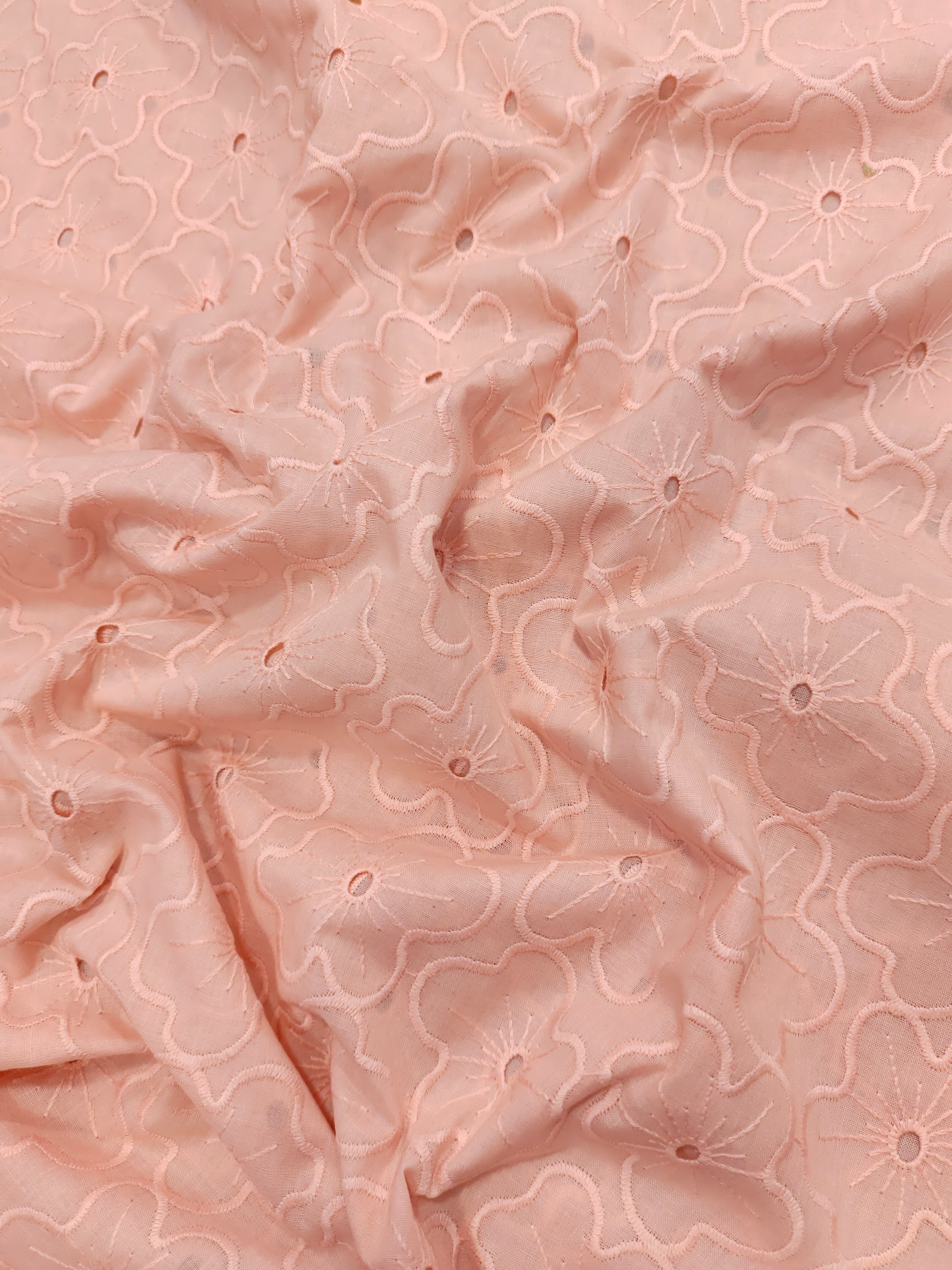 Peach cotton embroidery with small holes cut work