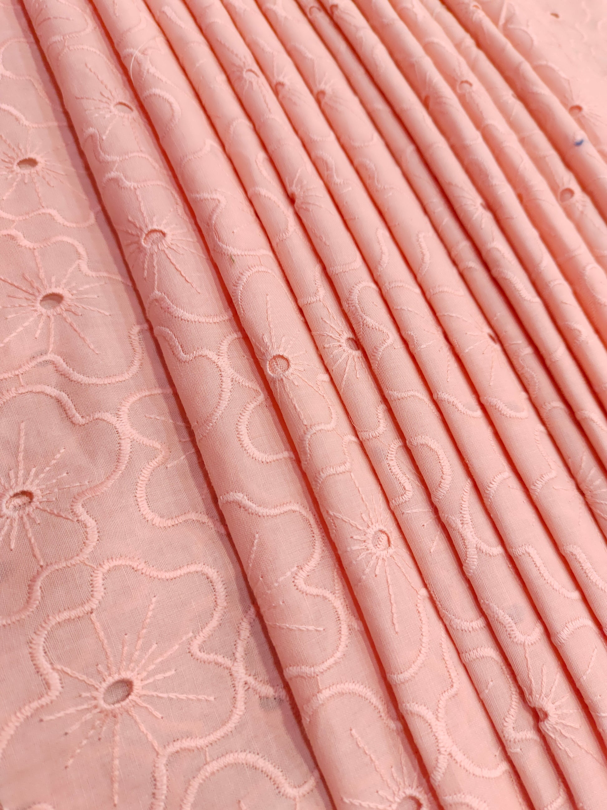 Peach cotton embroidery with small holes cut work