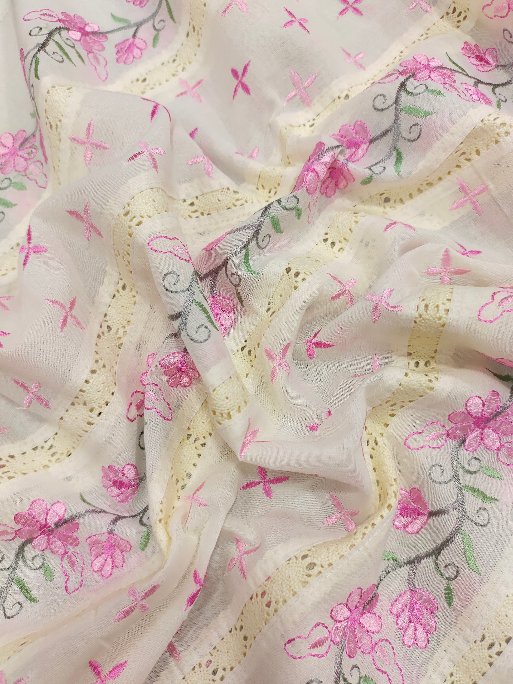 Cream fabric with pink embroidery and crochet lace