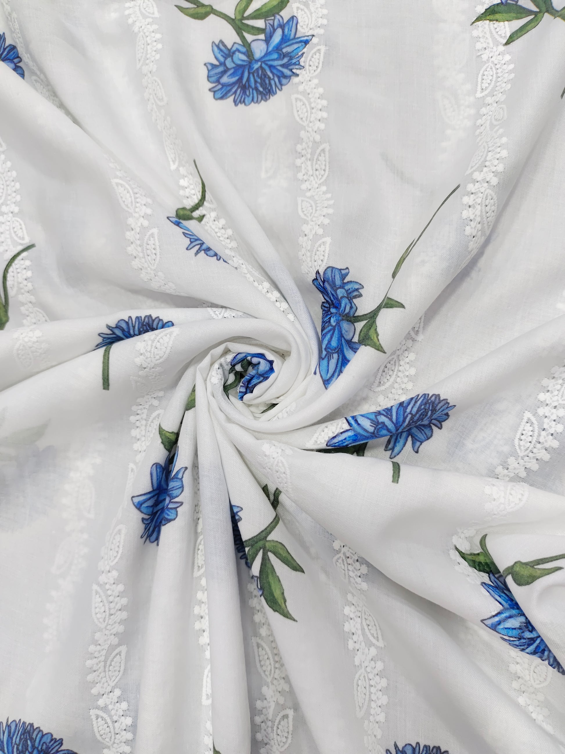 White embroidered with blue flowers