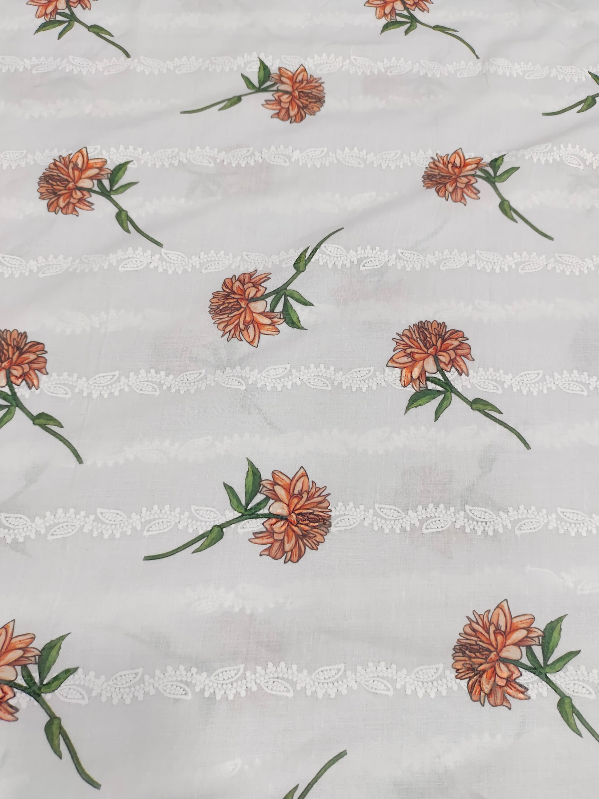 White embroidered with orange flowers