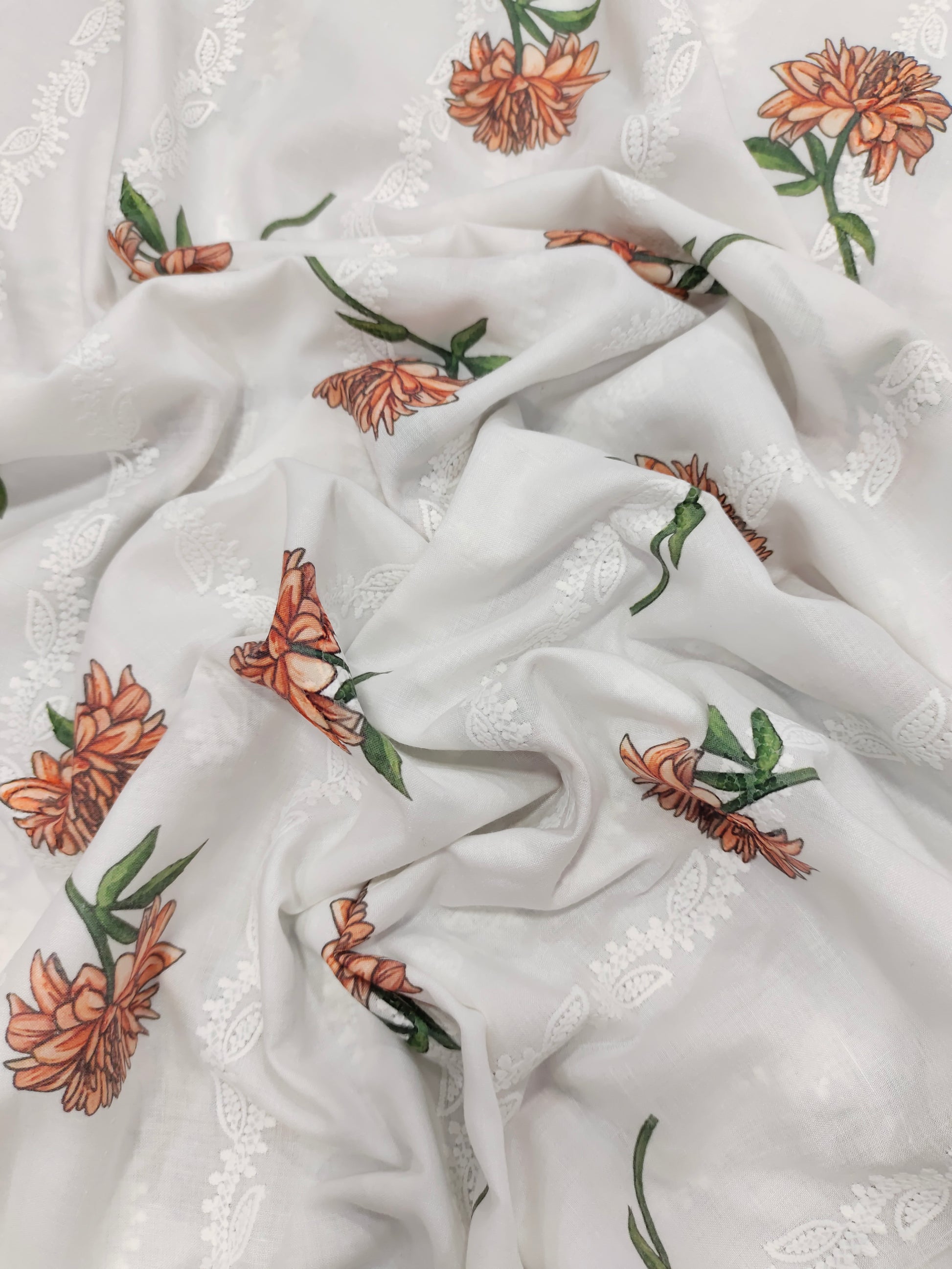 White embroidered with orange flowers