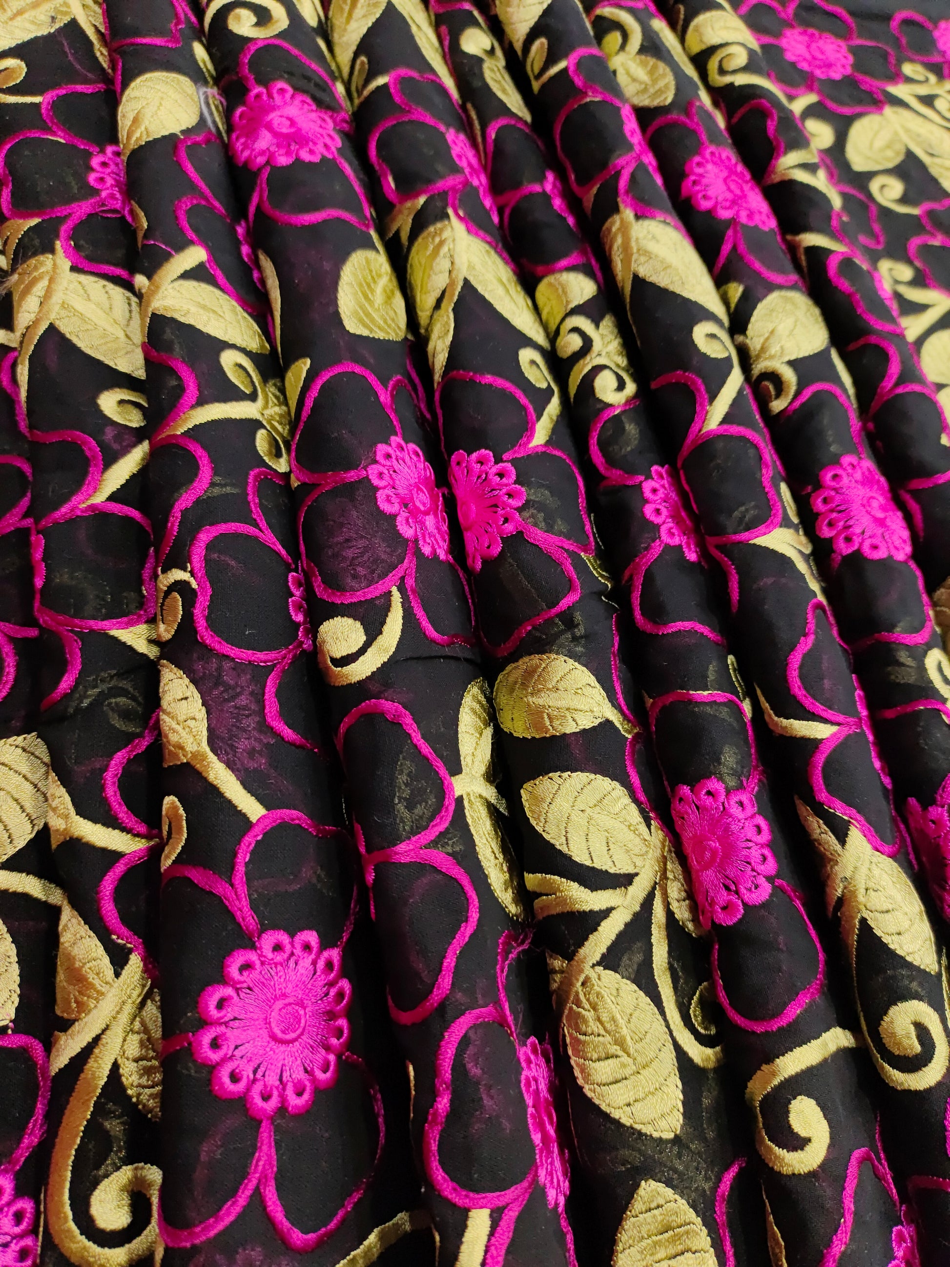 Black voile fabric with dark pink and green