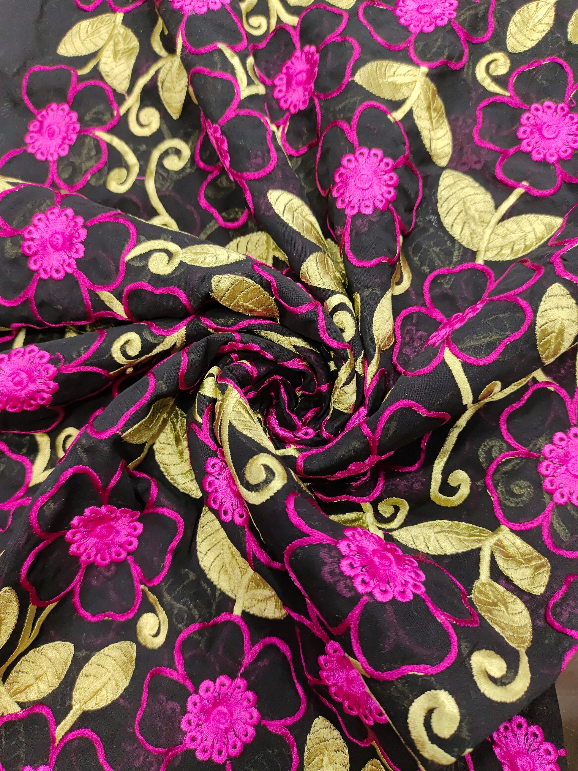 Black voile fabric with dark pink and green