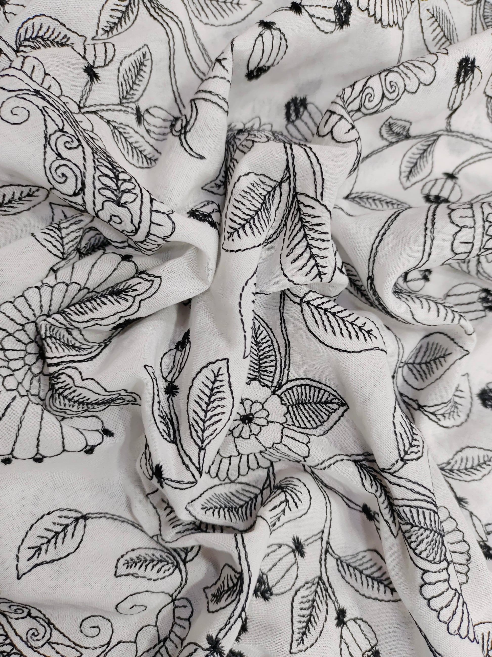 Voile fabric with black embroidery