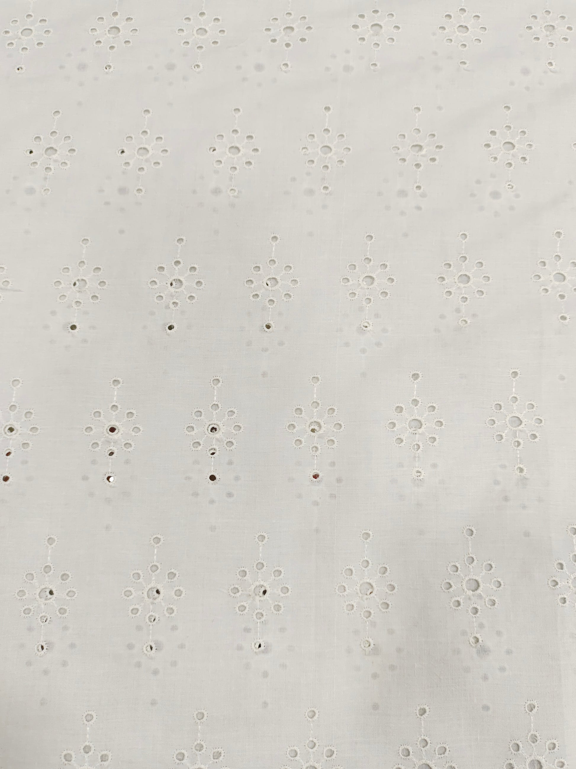 White embroidered cut work fabric