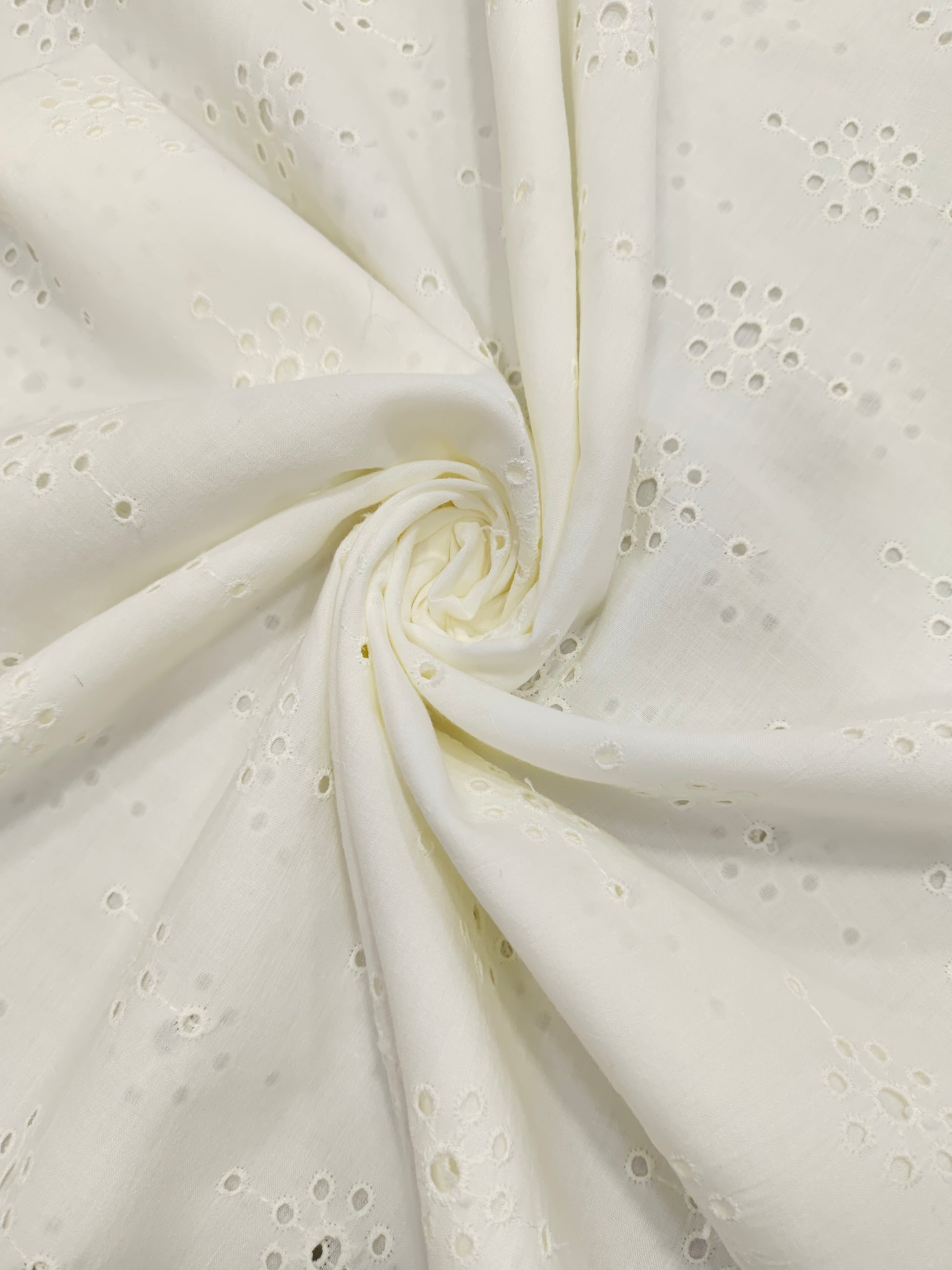 White embroidered cut work fabric