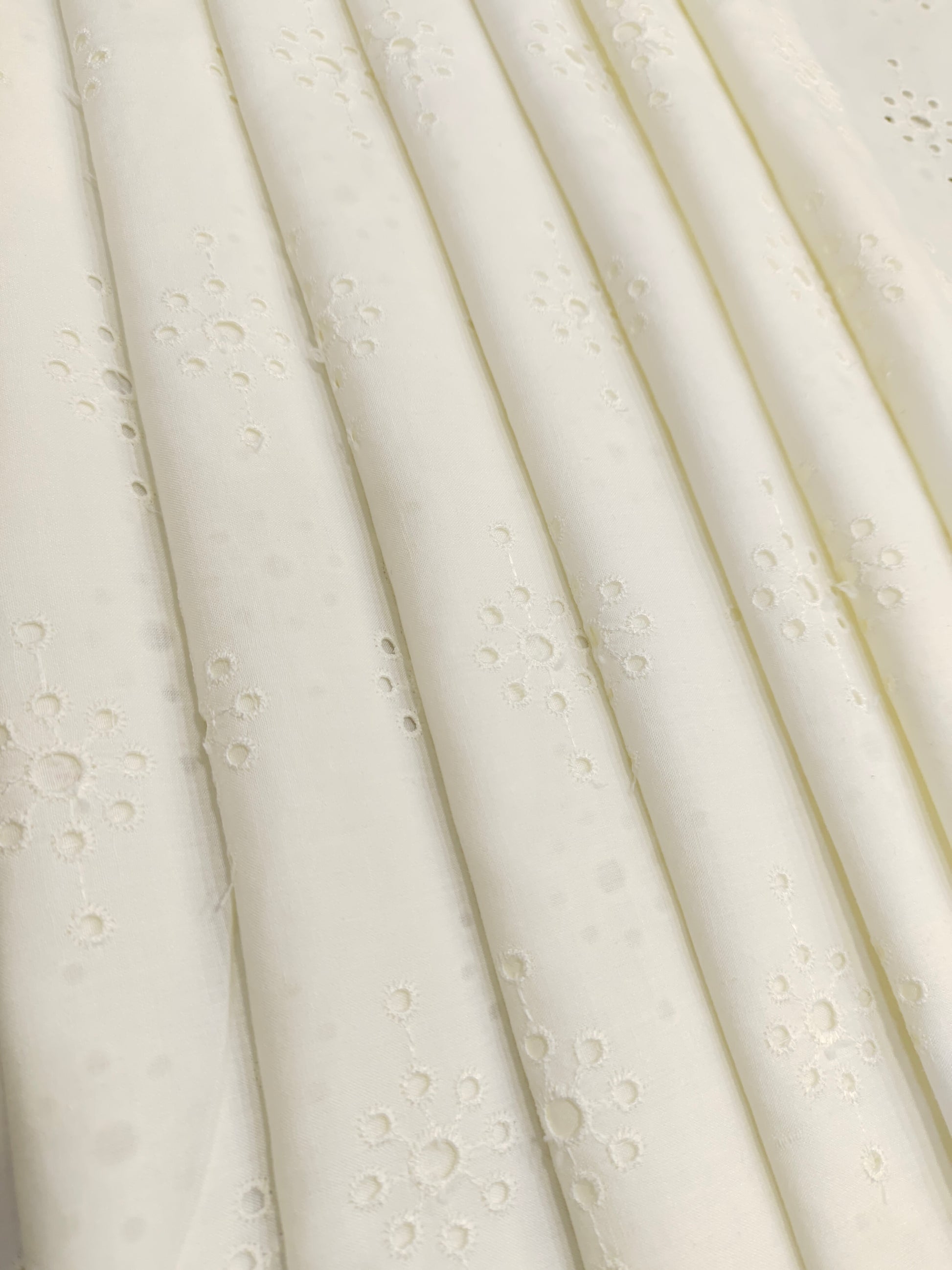 White embroidered cut work fabric