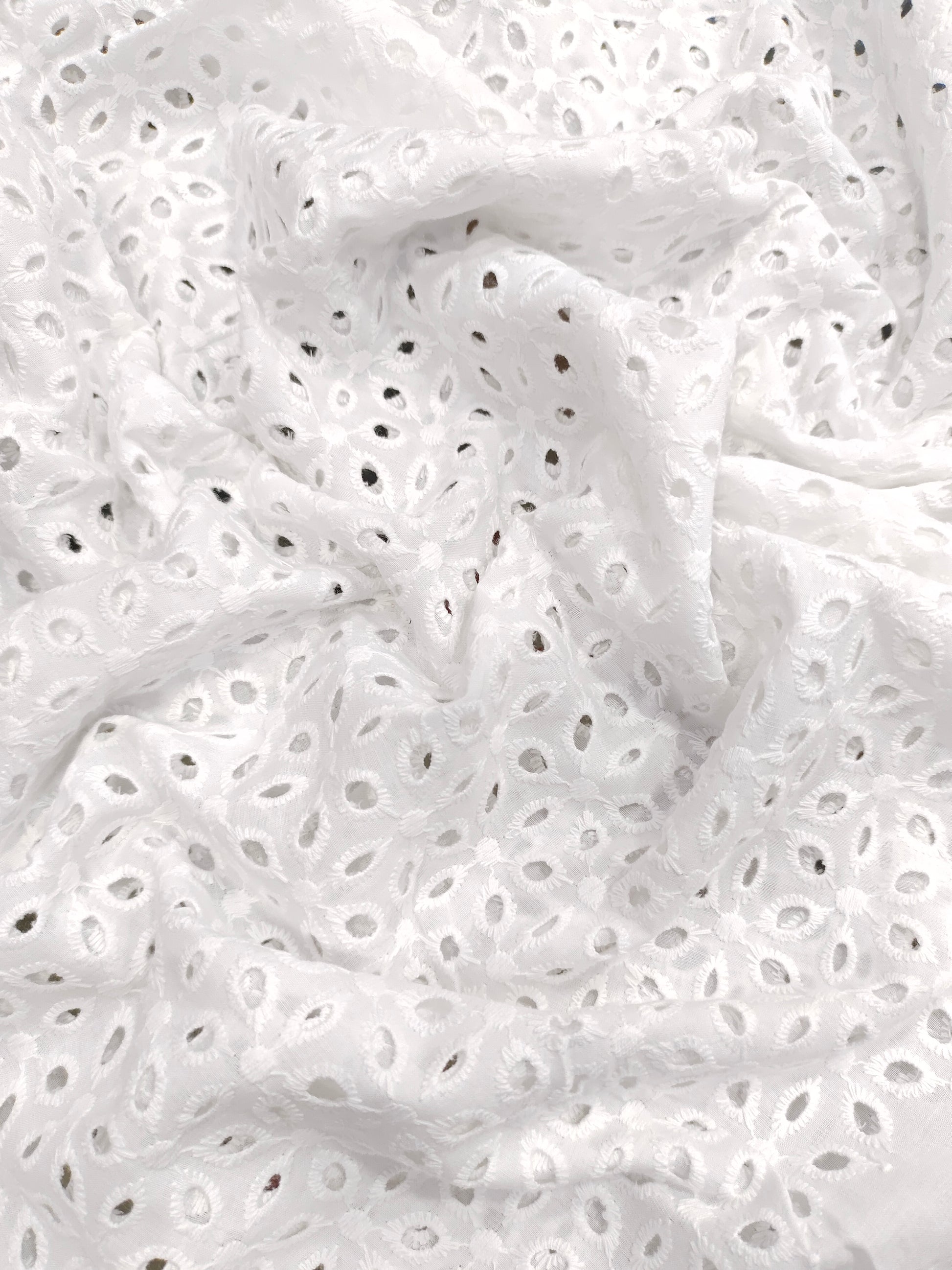 White embroidered cut work fabric