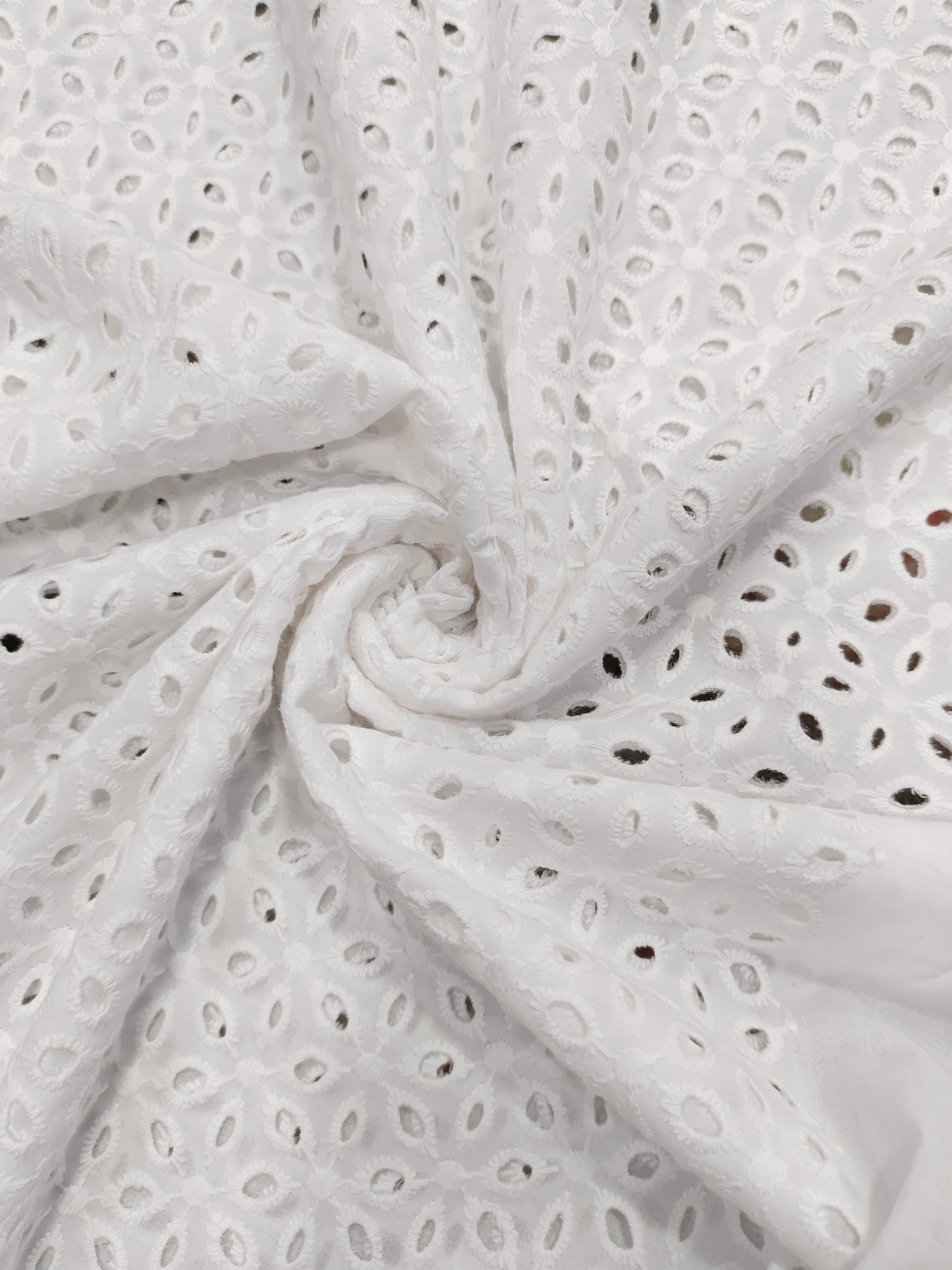 White embroidered cut work fabric