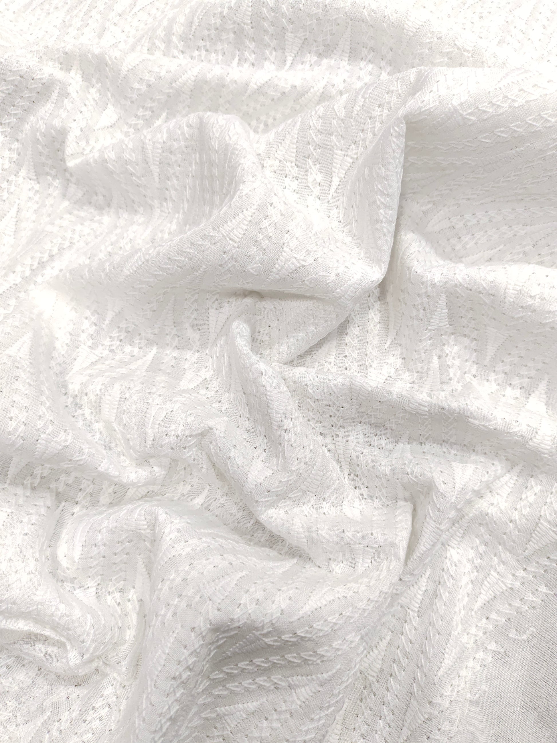 White cotton embroidered fabric