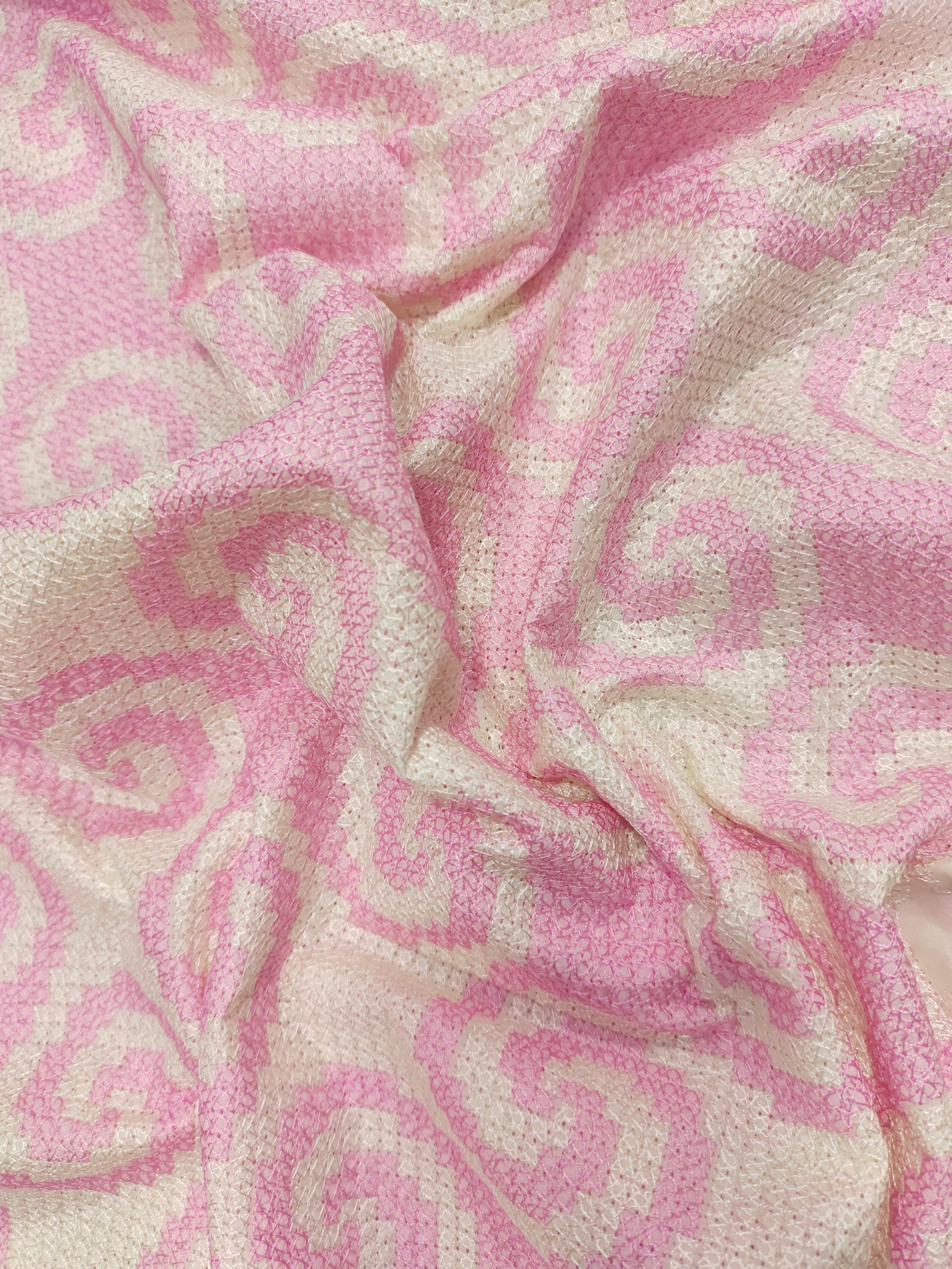 Cotton fabric with crosstitch work with pink and cream