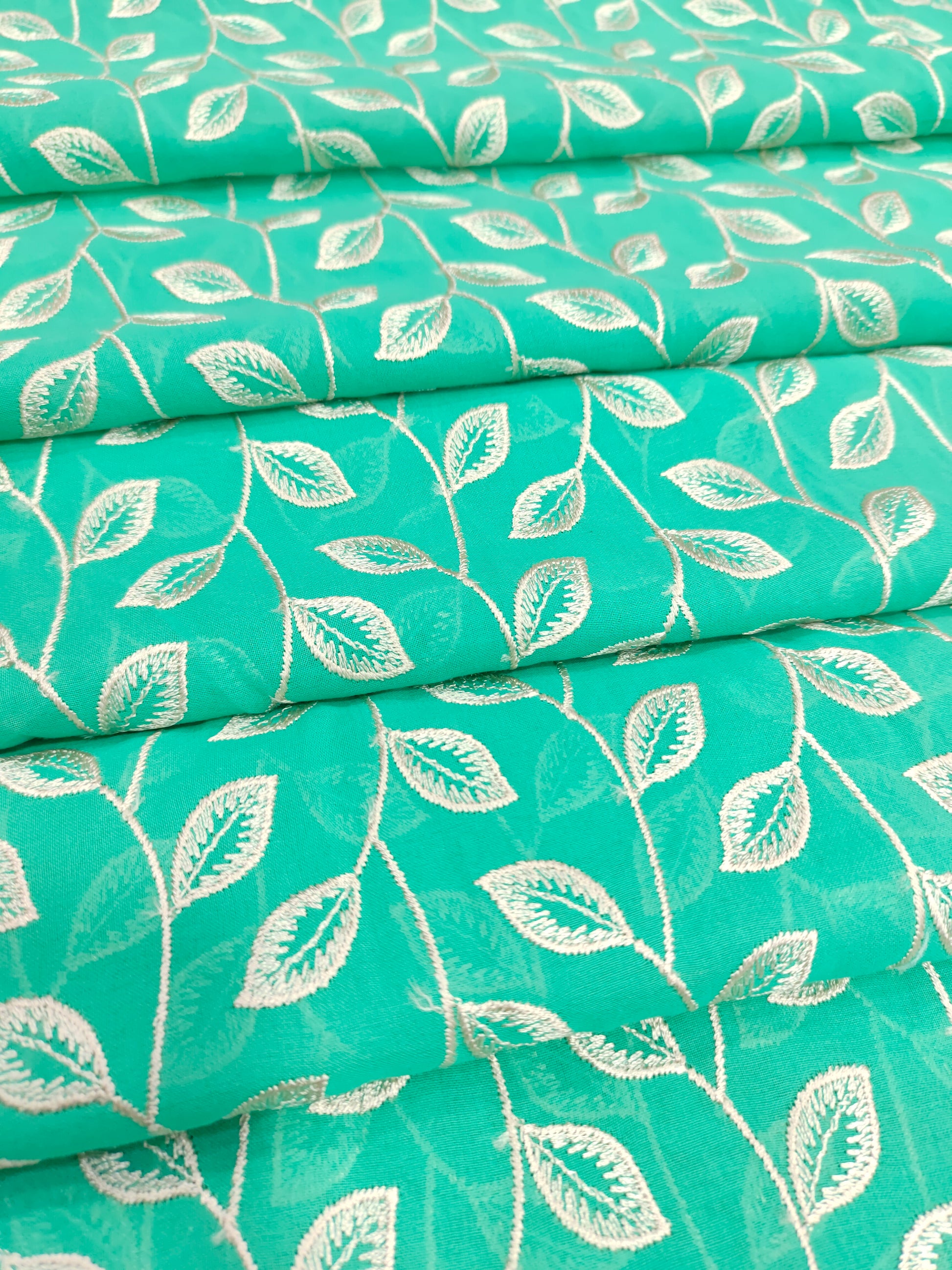 Voile embroidered fabric with beige leaves work