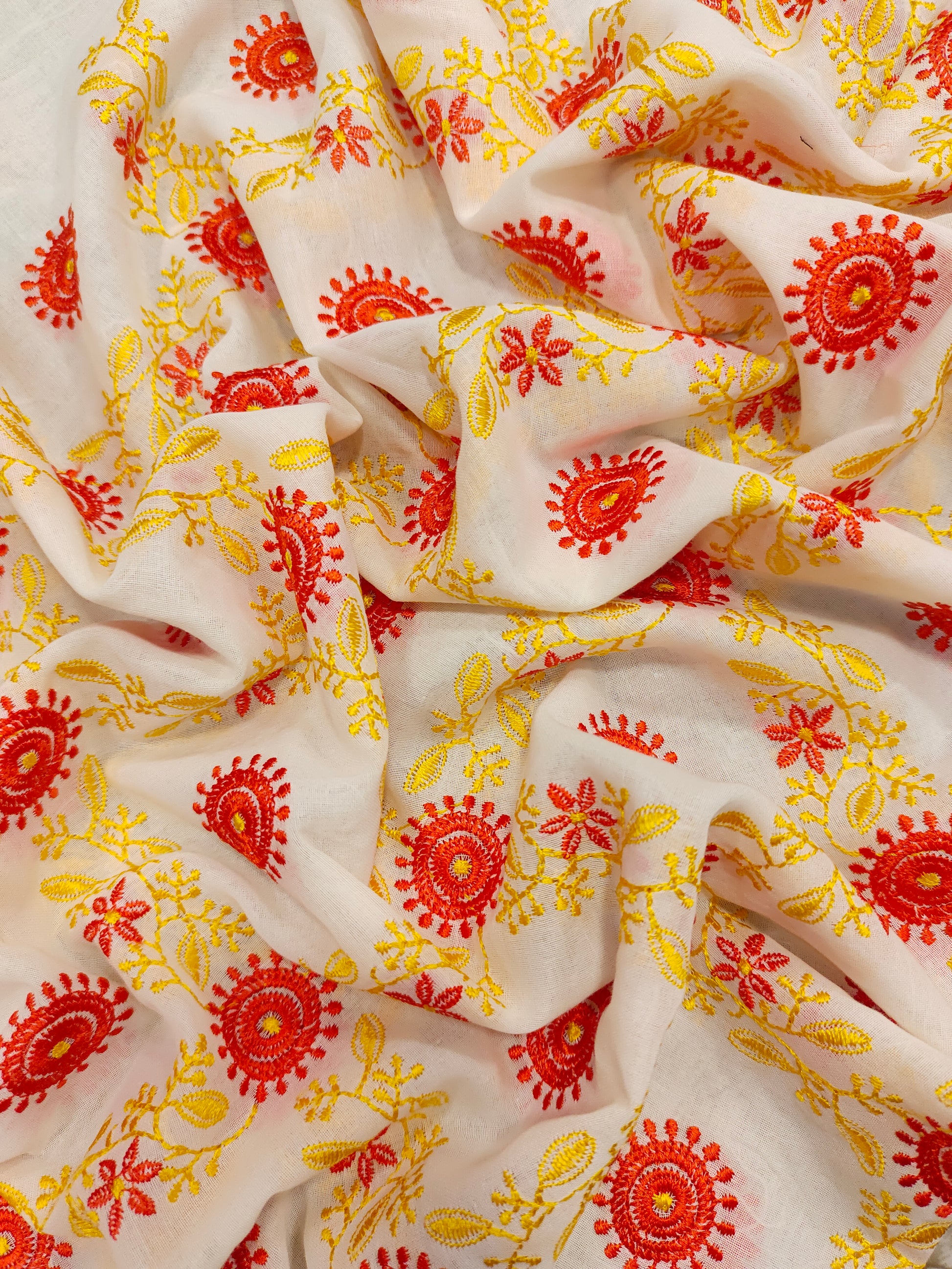 Voile yellow and orange embroidered fabric