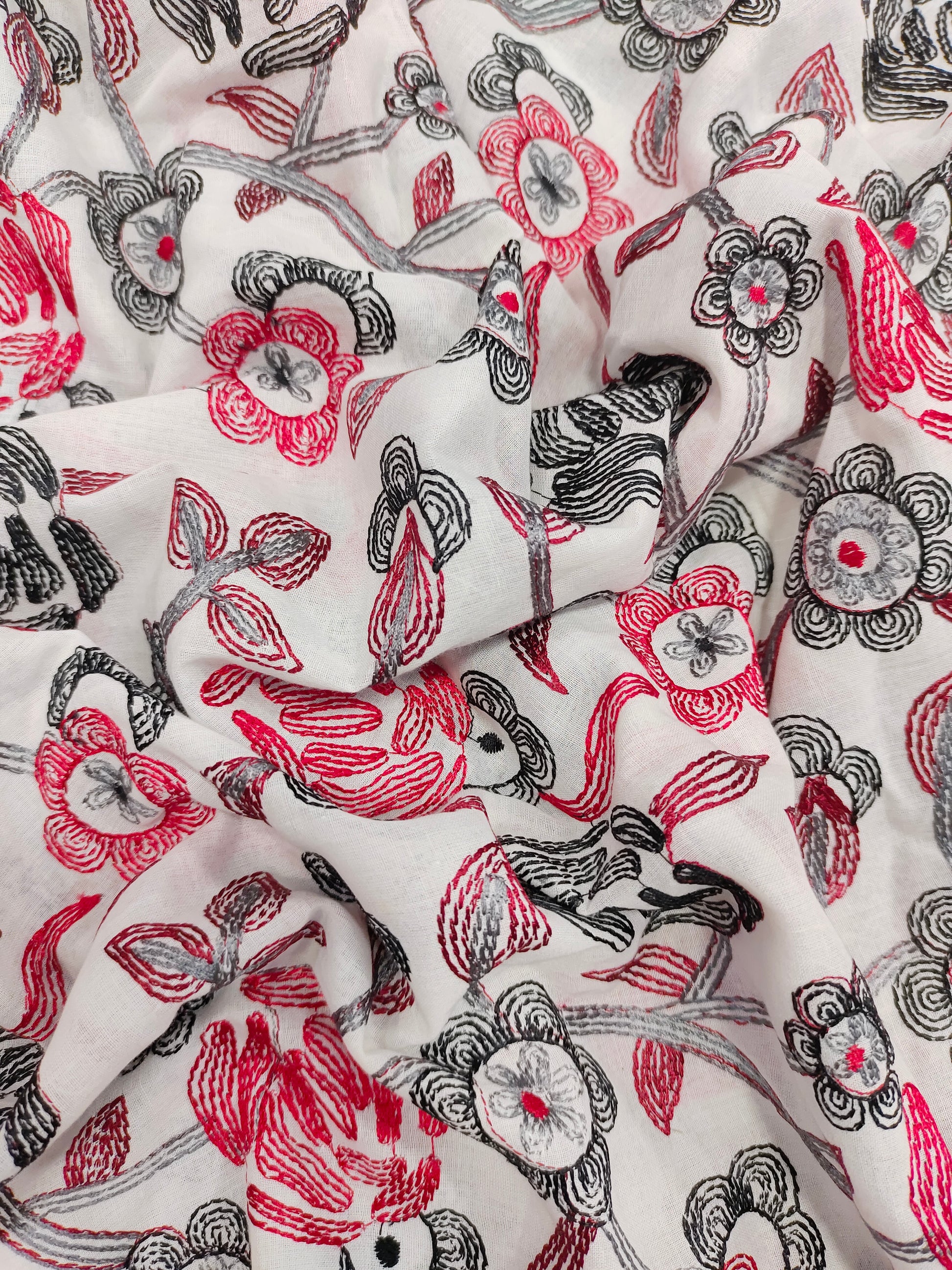 Voile embroidered fabric with red and black