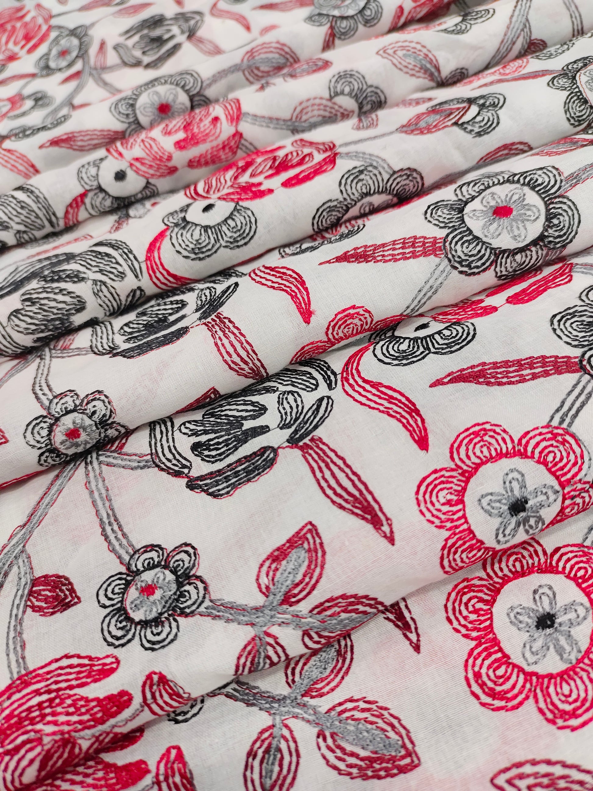 Voile embroidered fabric with red and black